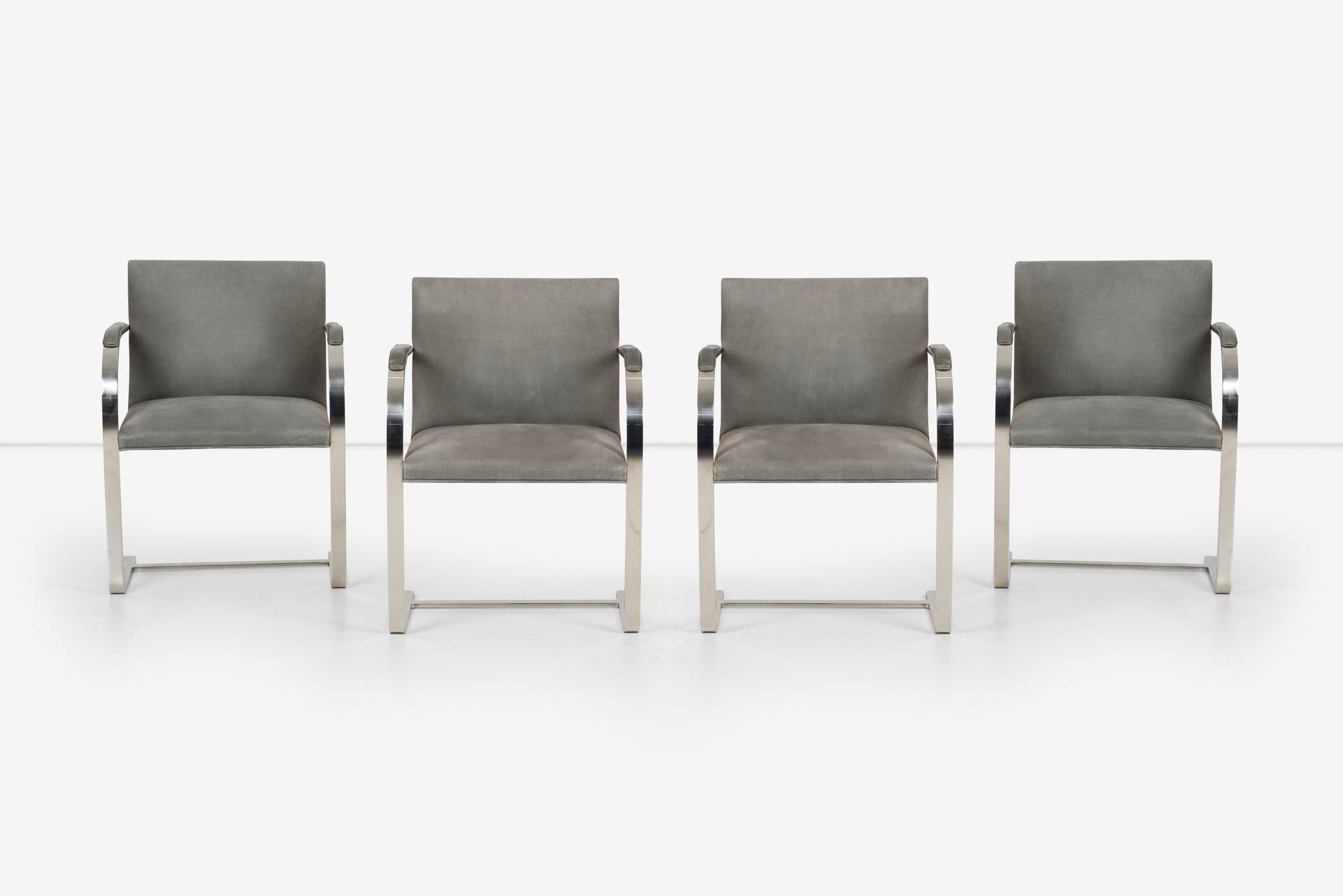 Mies van der Rohe for Knl set of Four Bruno chairs with arm pads, Original Gray leather with stainless steel frames.
* Seat Height (in): 17.5
* Arm Height (in): 25.75

Knl Labels on the underside.