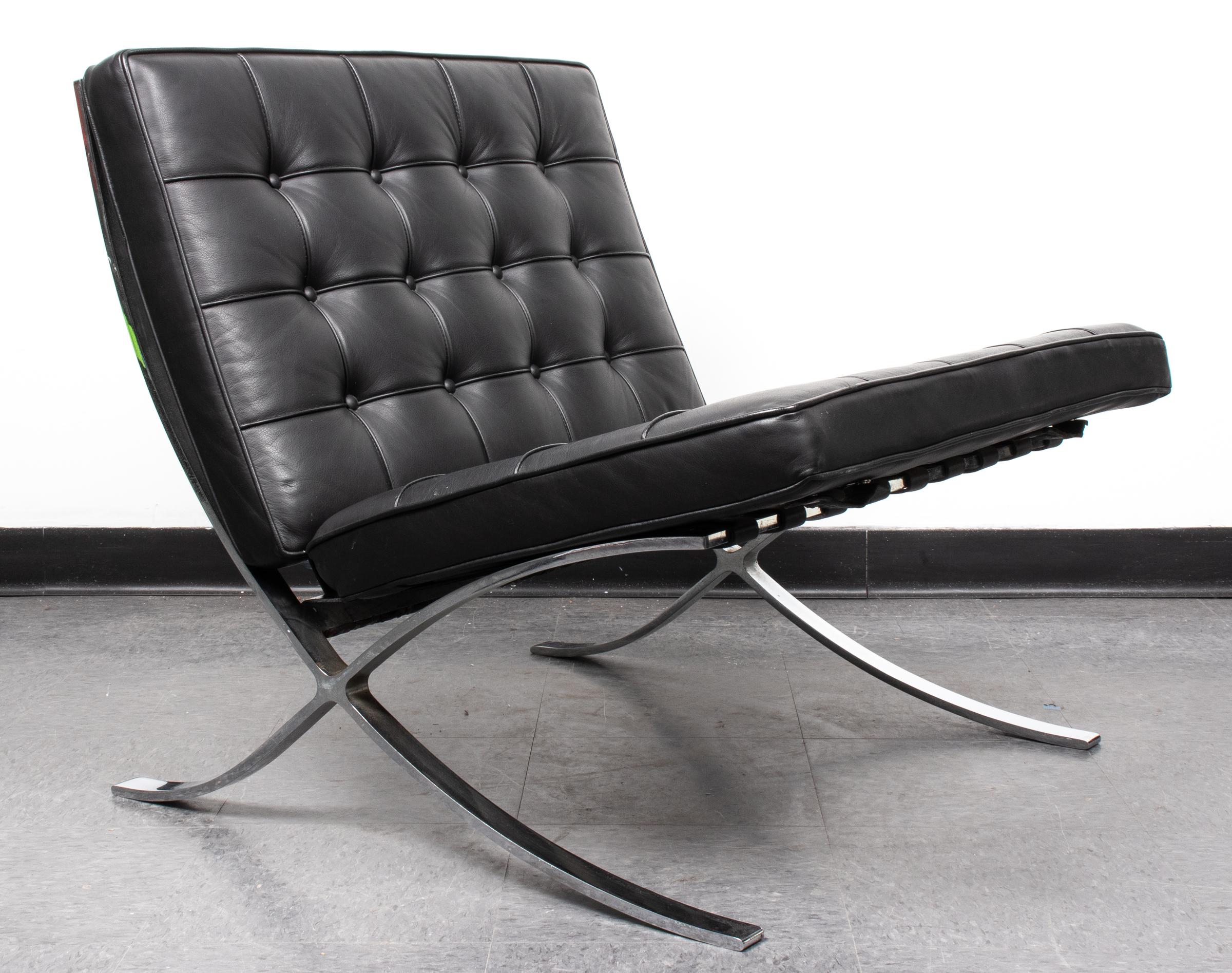 Mies van der Rohe Mid-Century Modern Barcelona chair, with rare chromed split frame and black leather upholstery. Measures: 29.25