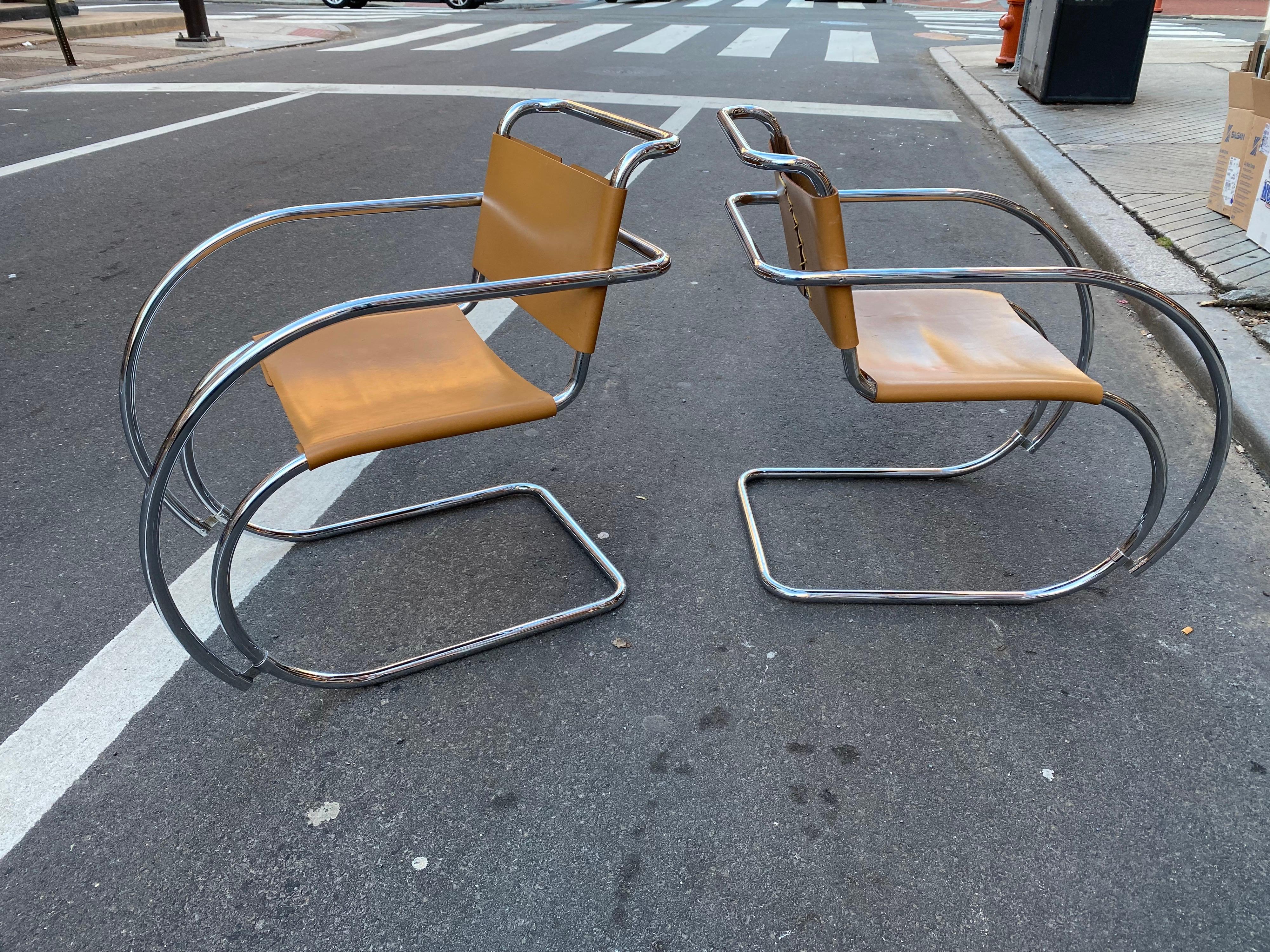 Pair of Mies Van der Rohr MR Lounge Chairs. Chairs probably date to the 1980's. Chrome in very good shape and Tan Leather Slings show minimal wear. Classic Modern Design!