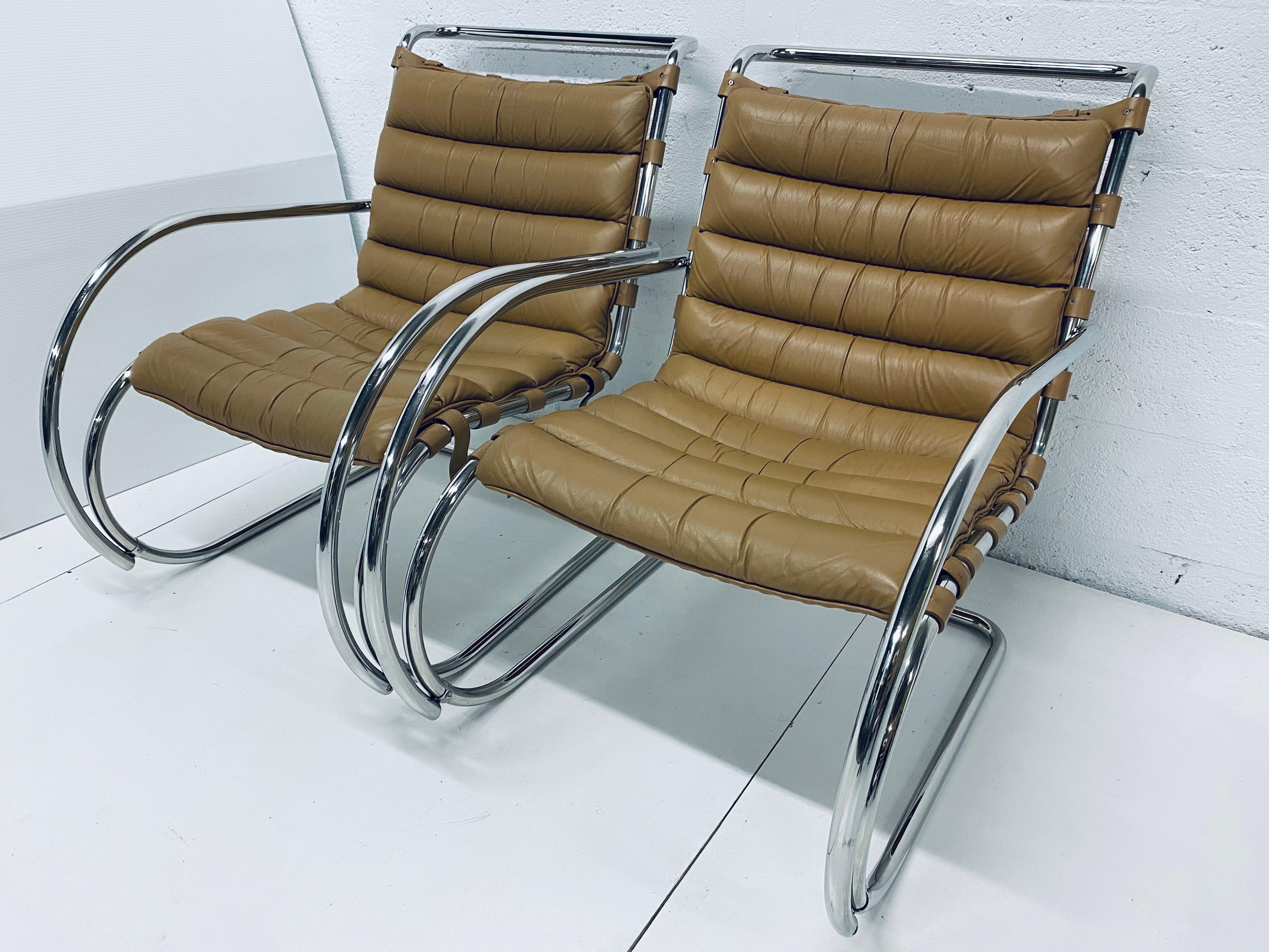 Pair of authentic MR lounge chairs with tan channel tufted leather over leather support straps and a tubular chrome frame designed by Ludwig Mies van der Rohe and produced by Knoll International, 1970s.