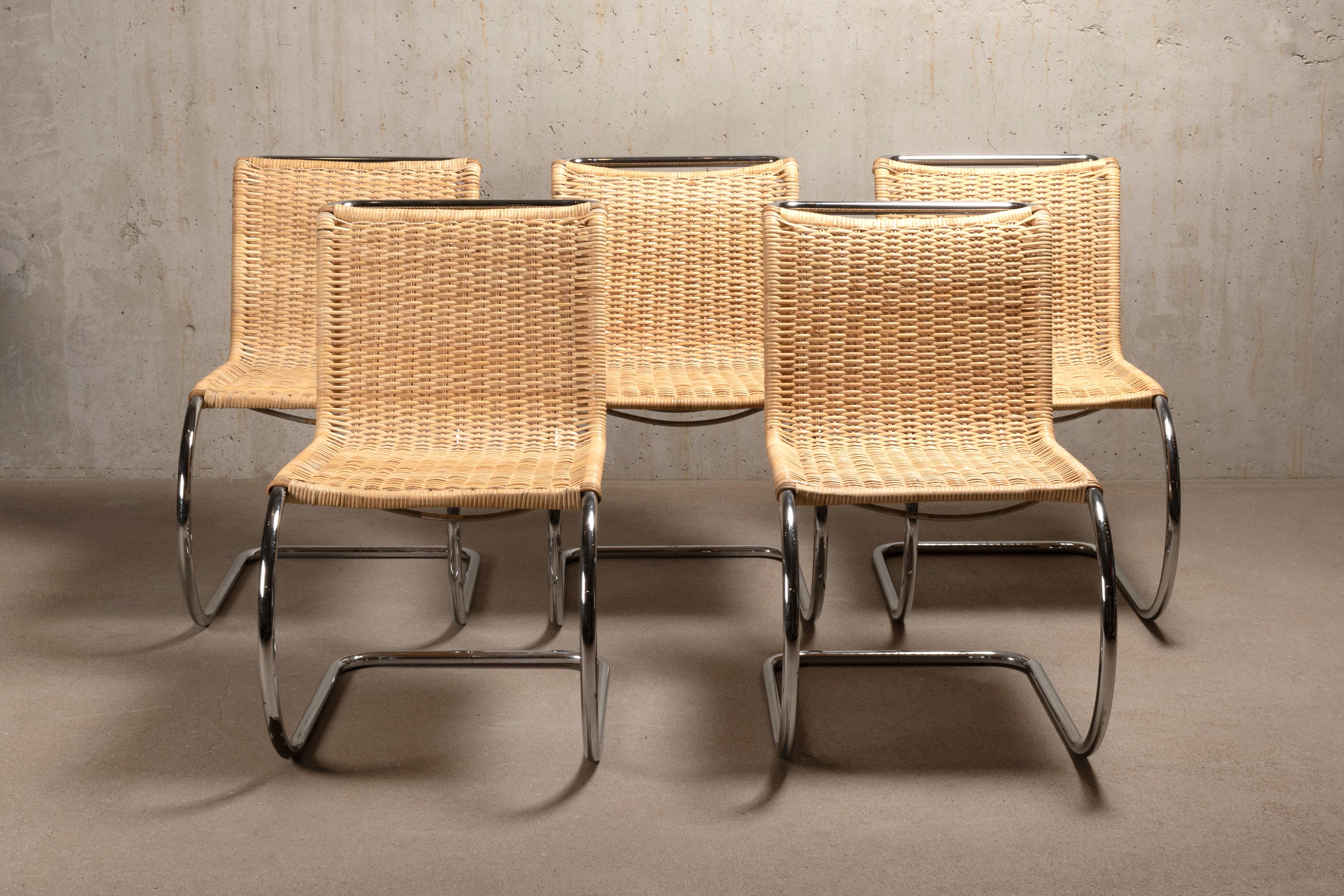Stunning set MR10 Cantilever chairs designed by Mies van der Rohe. Chrome plated metal frames with wear mainly on undersides of the slides. New woven cane in excellent condition with no defects. Most chairs are signed with Thonet labels.