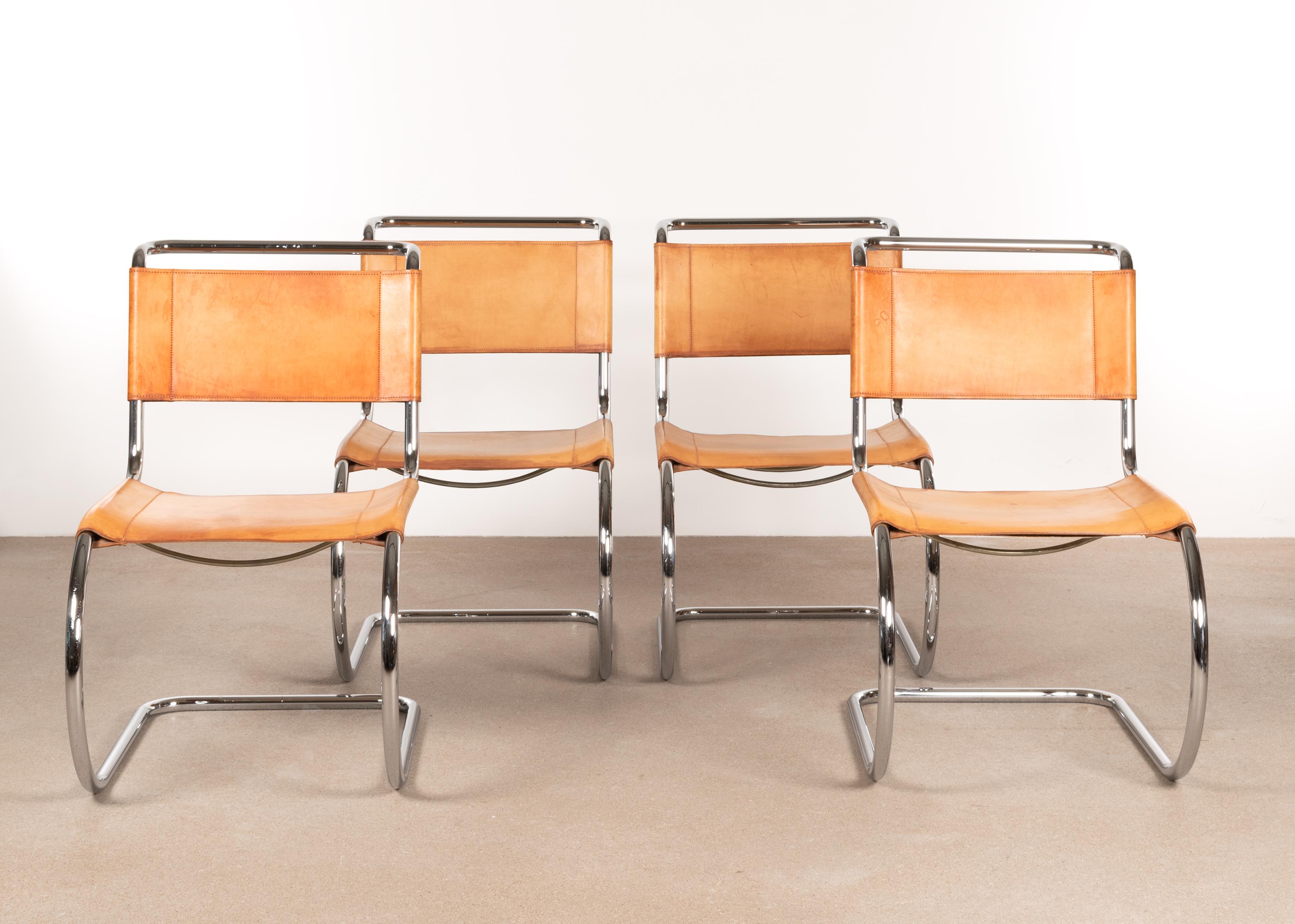Beautiful set of MR 10 (256CS) Cantilever dining chairs designed by Mies van der Rohe for Thonet. Chrome plated steel tubular frames with cognac coloured seats and backrest of strong saddle leather. The leather is in very good condition, not dried