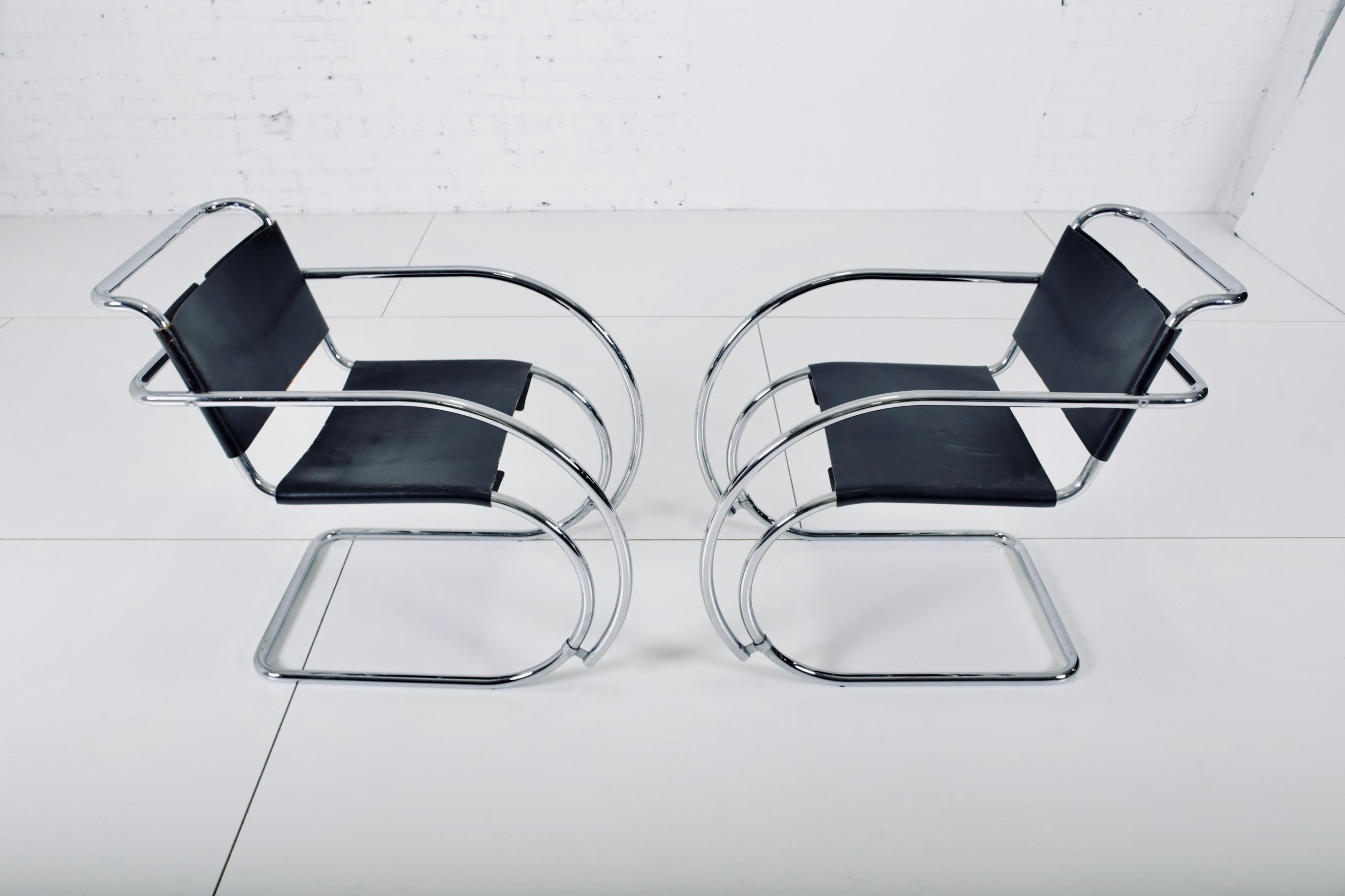 Pair of 1960s MR20 armchairs designed by Mies van der Rohe for Knoll. Original leather and stainless steel frames are in great shape. Chairs have early Knoll labels.

 