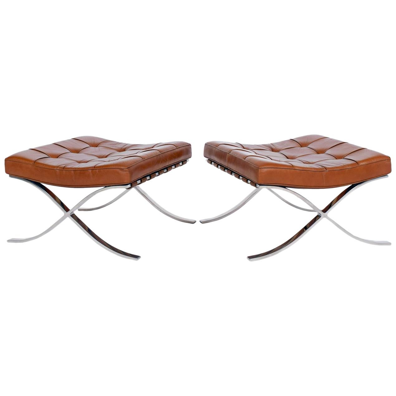 Designed in 1928 by Mies van der Rohe, this pair is vintage 1970s. Stainless steel X-frame occasional stools with natural leather seat and leather lacing. Made by Knoll International.