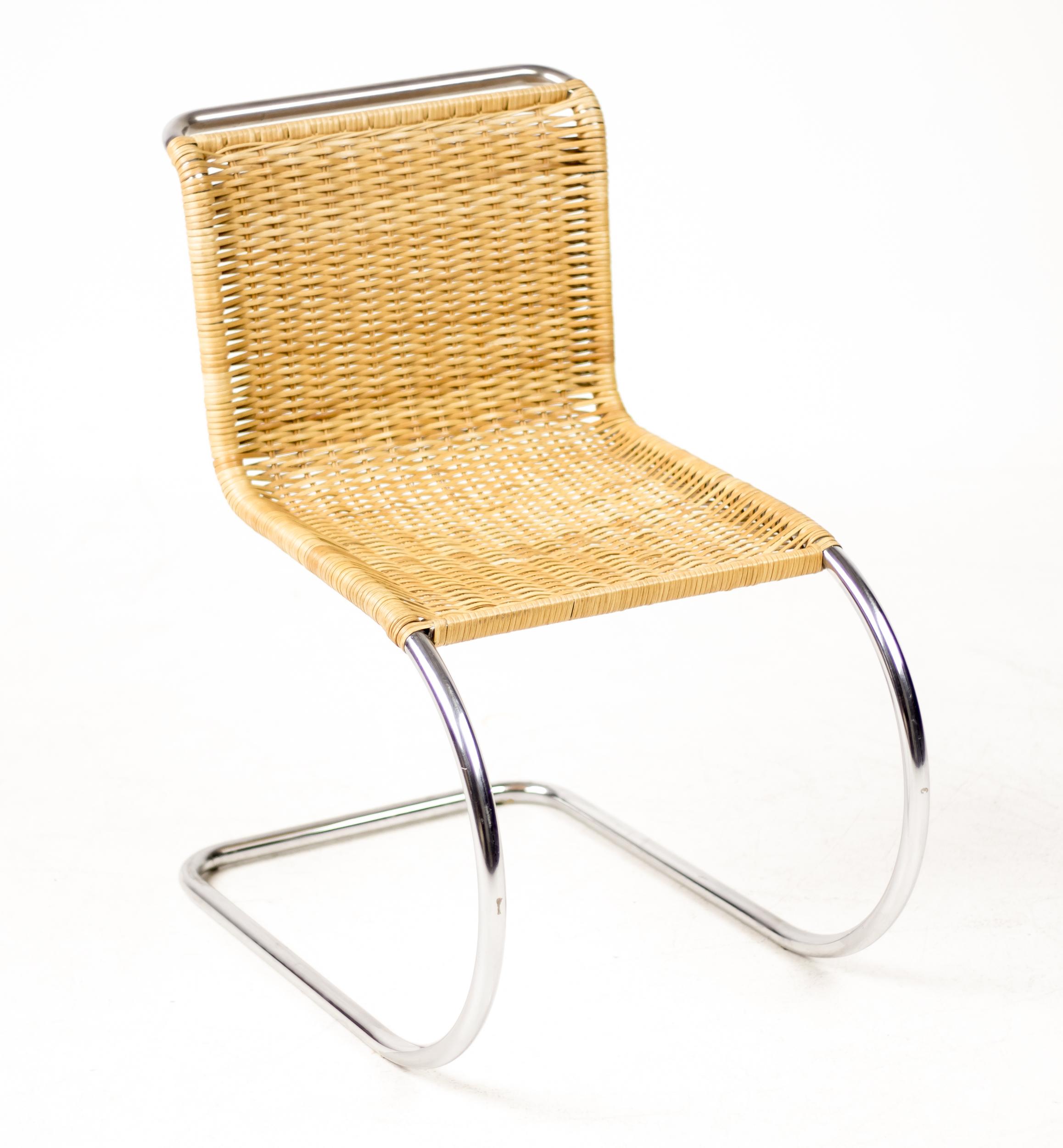 This chair’s deceptively simple design embodies the “less is more” philosophy of Mies van der Rohe. The ultra-modern chrome finish sharply contrasts with the natural woven-cane seat and back, creating a streamlined appearance that exemplifies