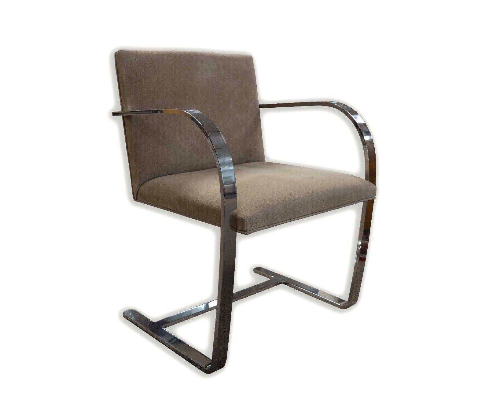 This set of six BRNO chairs by Mies Van Der Rohe epitomizes the sleek, minimalist aesthetic of mid-century modern design. Each chair features a lustrous chrome frame that creates an elegant contrast with the plush ultra suede upholstery, offering a