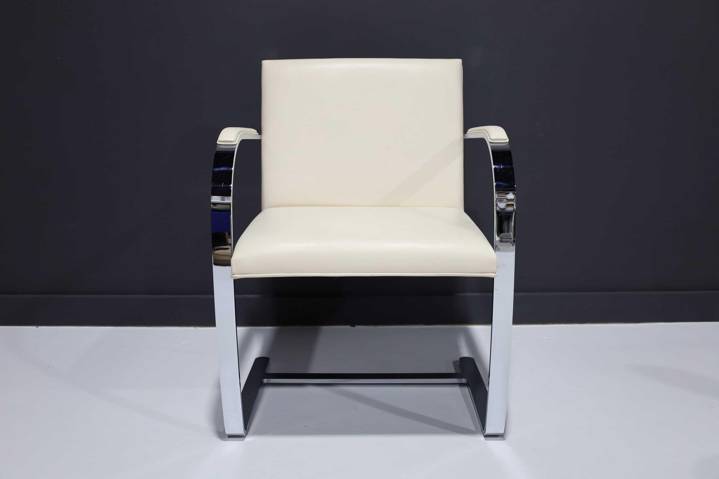 The iconic Brno chair by Mies van der Rohe for Knoll. This is a nearly new set of chairs in high-quality off-white Sabrina leather with arm pads. These are polished stainless steel as opposed to the chromed steel. Much stronger quality. These are