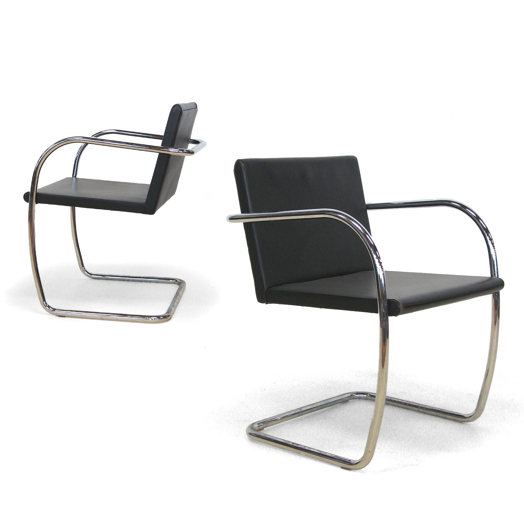 We think this version of Mies' Brno chair with it's thin seat and back is the most elegant and comes closest to his minimalist ideal. Upholstered in black leather, this pair is in good original condition.

Measures:31.25
