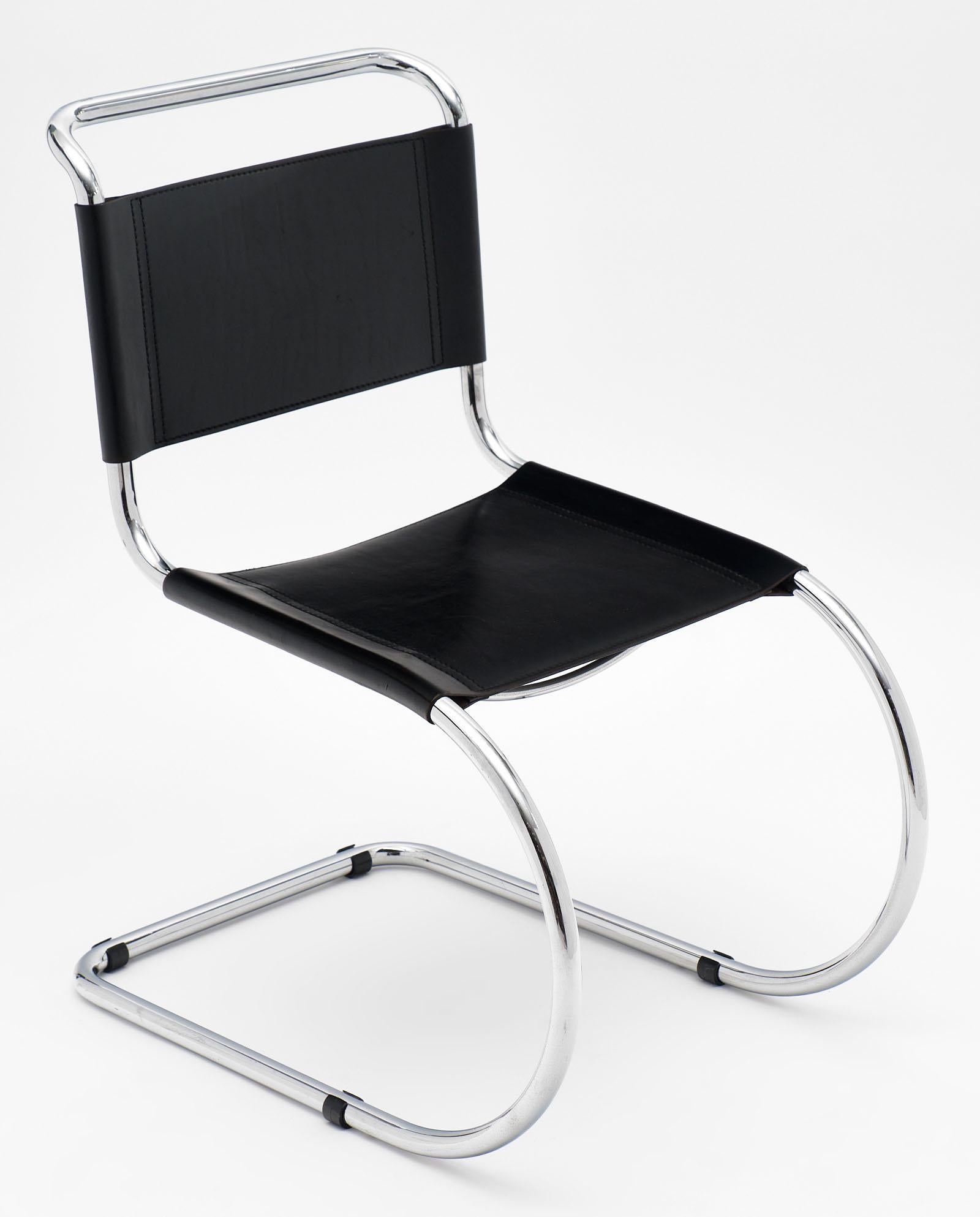 A pair of vintage Mies van der Rohe cantilever chairs with chromed metal structures and black leather seats. We love the spirit of Bauhaus in this design. The leather is nice and thick with a beautiful patina. Iconic lines!