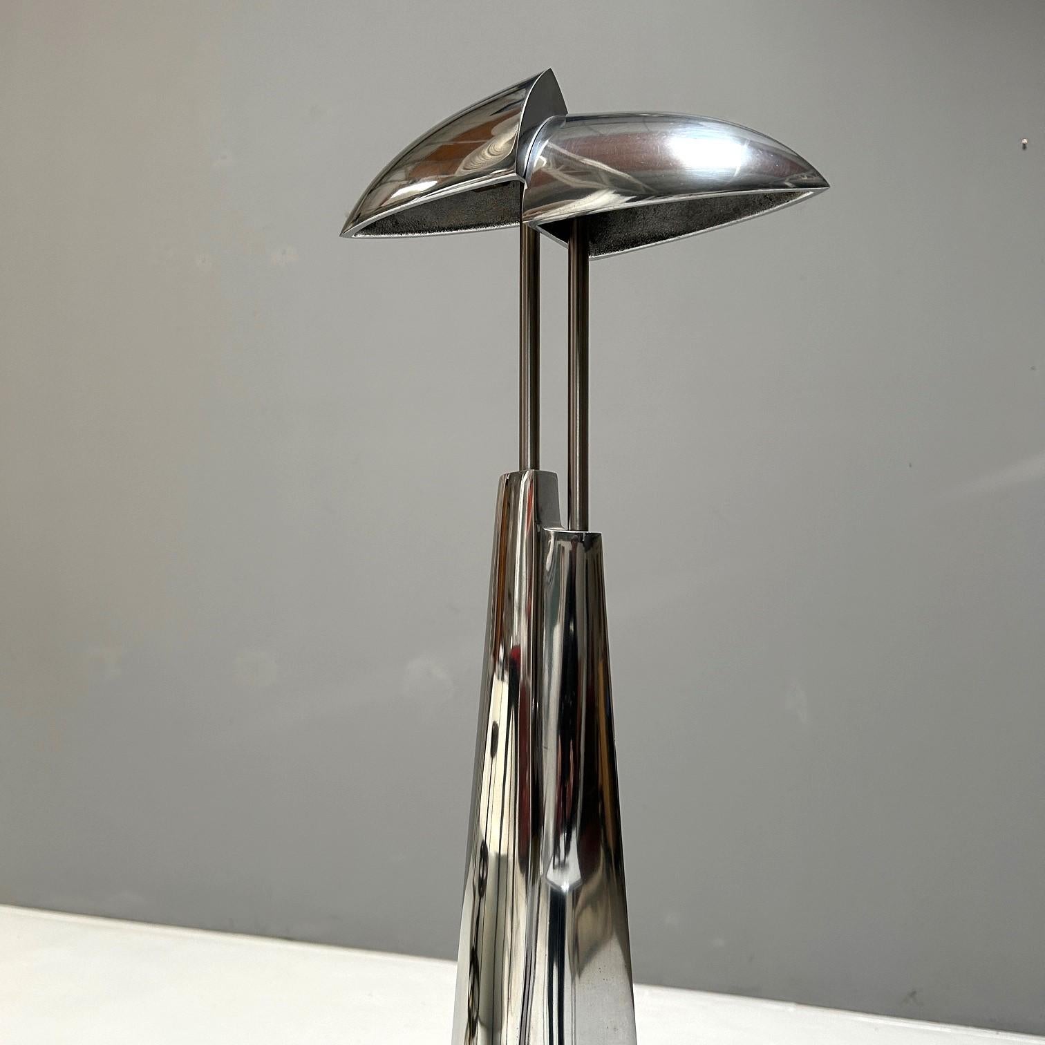 Sculptural table lamp by Ullrich Mies and Annette van Gessel in solid polished cast aluminium.

Annette von Gessel and Ullrich Mies designed an impressive sculptural table lamp, reminiscent of two figures standing back to back. Their work blurs the