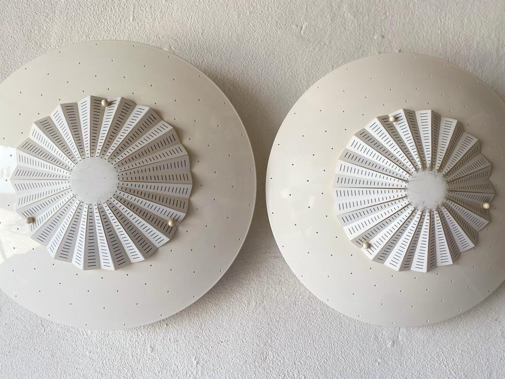 Migale Pair of Sconces or Flush Mount by Vico Magistretti for Oluce, 1960, Italy

Large Minimalist and rare design. 

Lampshade is in good condition and very clean. 
This lamp works with E27 light bulbs. 
Max 100W Wired and suitable to use with 220V