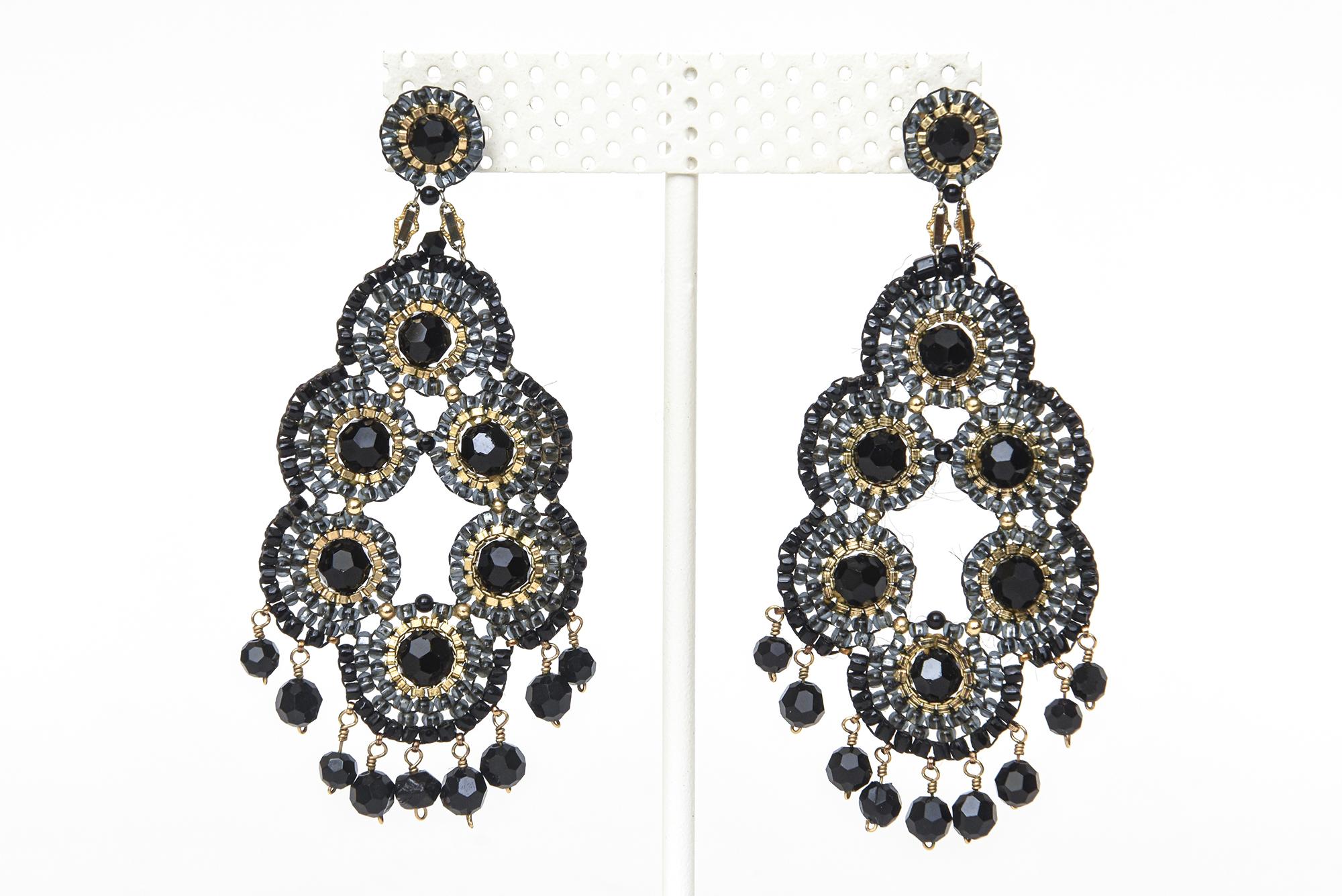 These dramatic Miguel Ases beaded chandelier pierced earrings have gold metal and black onyx beads. The lightweight of the earrings is great so it does not weigh down your earlobe. Comes with the original pouch. Originally from Neiman Marcus. From