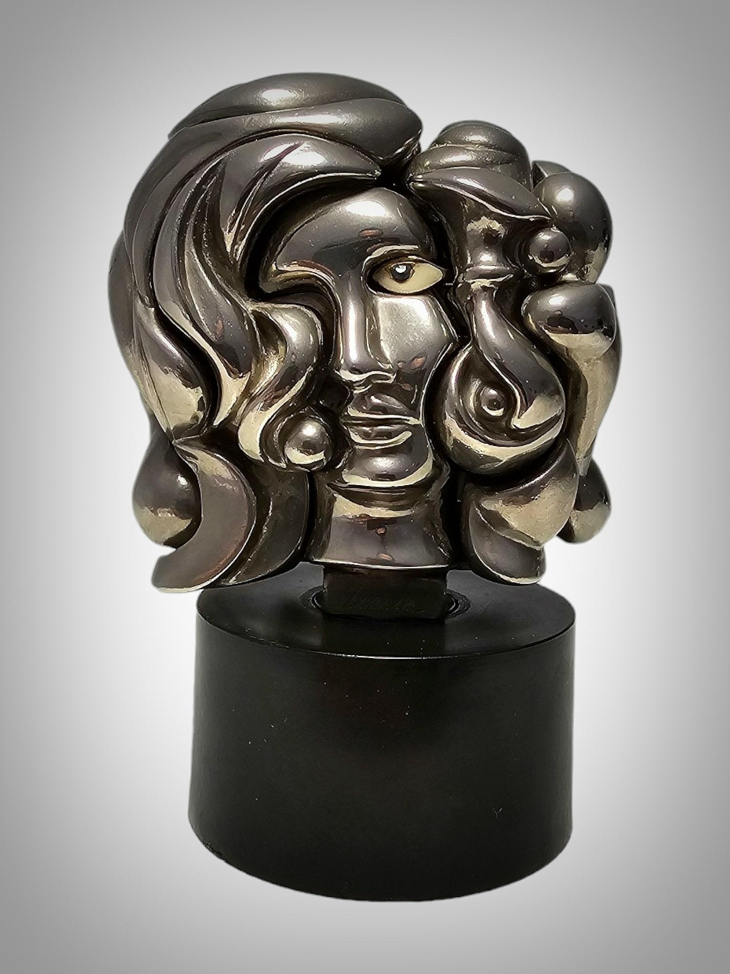 This wonderful vintage mini Miguel Berrocal puzzle element sculpture of the bust of a woman called Portrait de Michelle is comprised of 17 individual components. It is a puzzle of great craftsmanship done by a Spanish sculptor. It is three