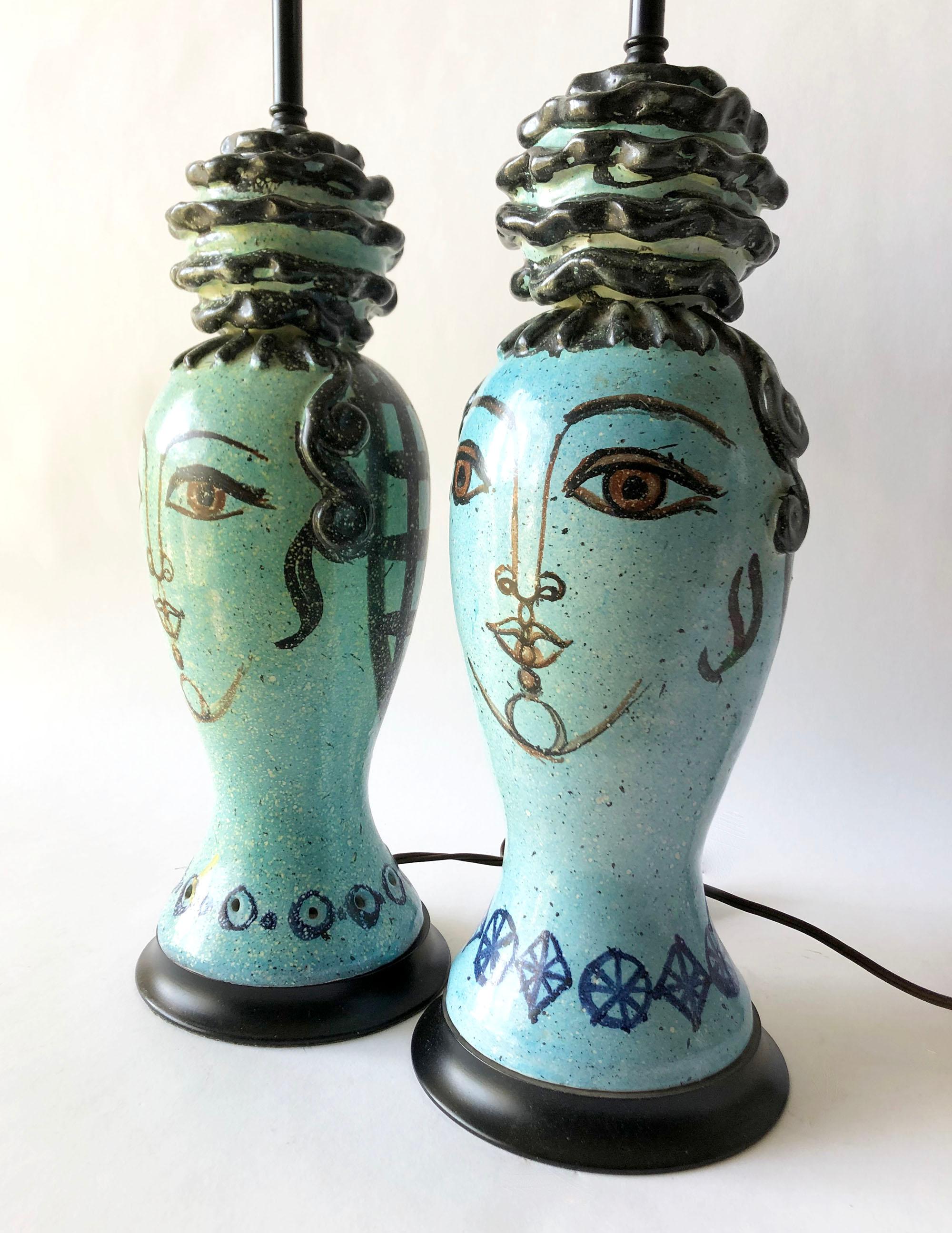 Pair of lamps created by Miguel Durán-Loriga for the Alfaraz workshop of Madrid, Spain. Lamps are hand thrown and decorated with elaborate chignon hair styles of the Spanish Flamenco tradition. Lamps overall measurement is 20
