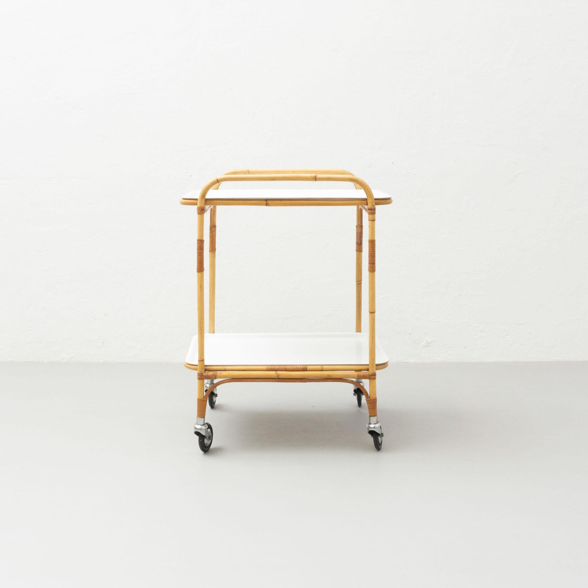 Trolley designed by MMiguel Milà, circa 1960.

In original condition, with minor wear consistent with age and use, preserving a beautiful patina.

Materials:
Bamboo
Plastic

Dimensions:
D: 56 cm
W: 46 cm
H:74 cm

About the