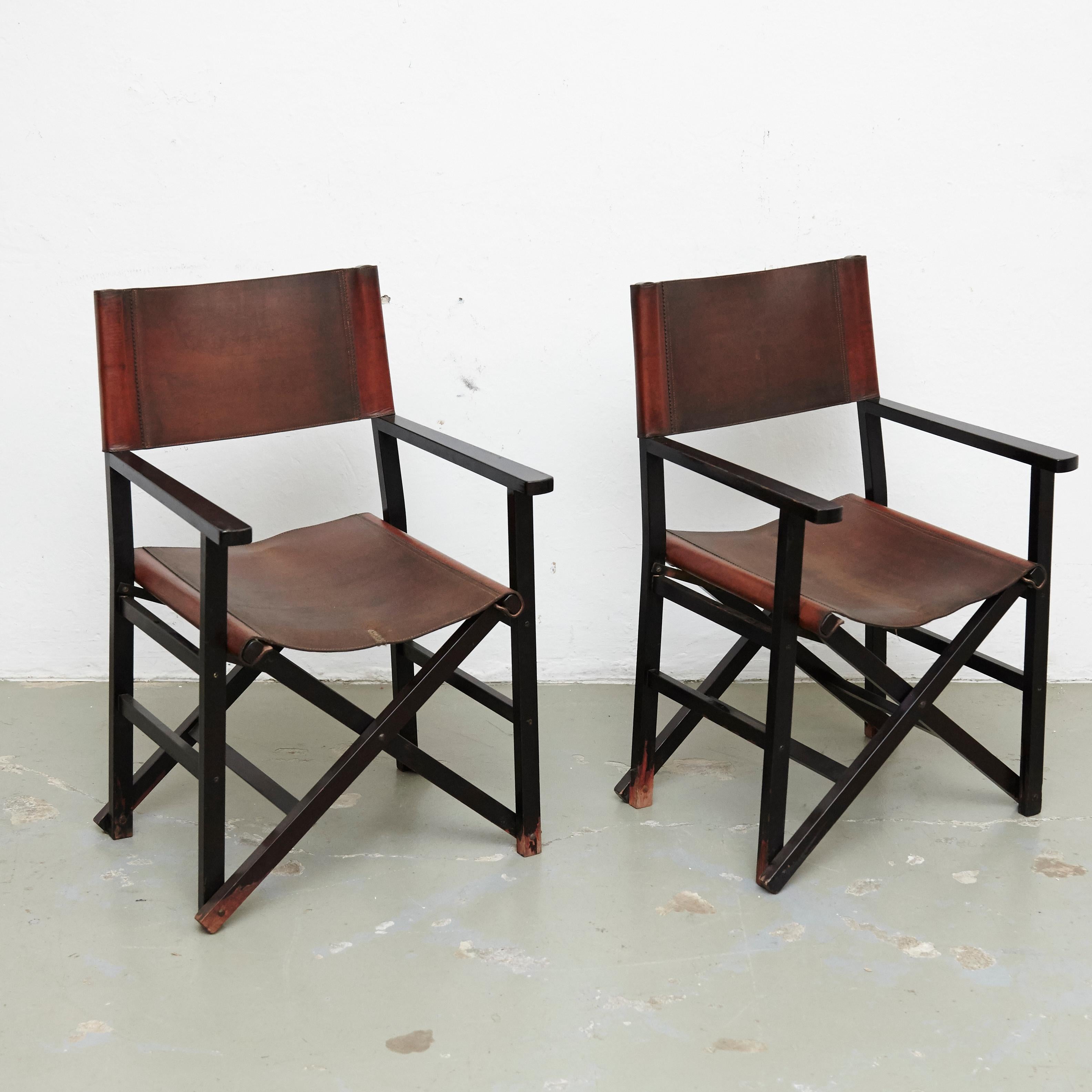 Set of four leather folding chairs designed by Miguel Mila.
Manufactured by Gres Edition, Spain, circa 1960. 

In good original condition, with minor wear consistent with age and use.

Materials and color:
Leather
Wood

Dimensions:
D 56 cm