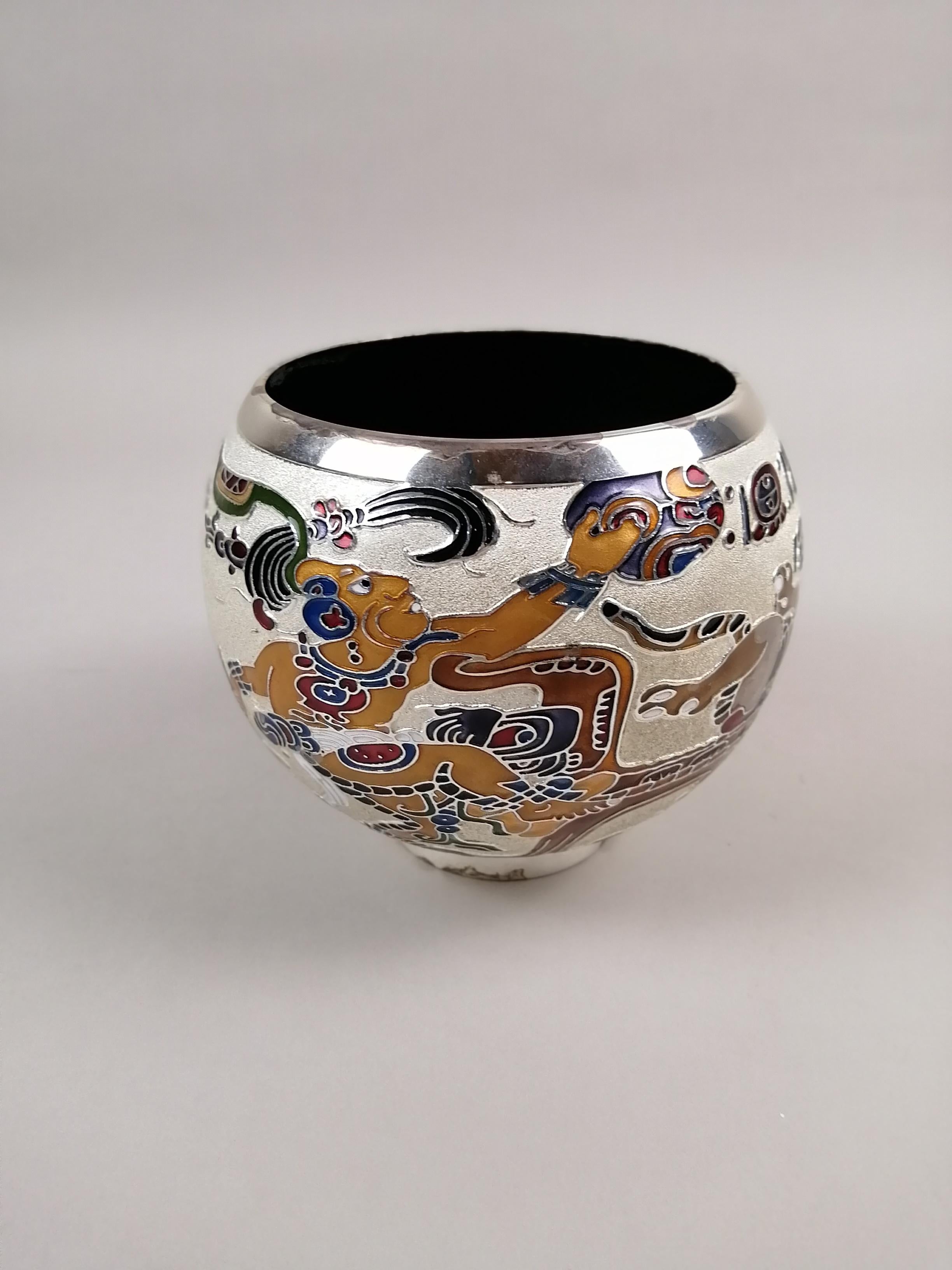 A fine Mexican silverplate and enamel bowl with Neo-Mayan decoration by Miguel Pineda. Made in Mexico City during the 1980s. The decoration is inspired by paintings found in Pre-Hispanic Mayan ceramics. Signed on the lower edge.