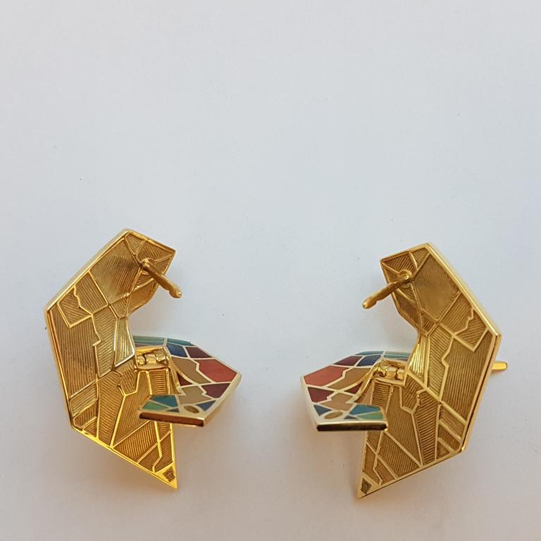 Earrings Metaphysical Head designed and manufactured by the Sasonko Jewellery House based on Mihail Chemiakin's image
18 karat yellow gold 
Hot colorful enamel
Chemiakin’s Metaphysics series draws comparisons between incompatible objects based on