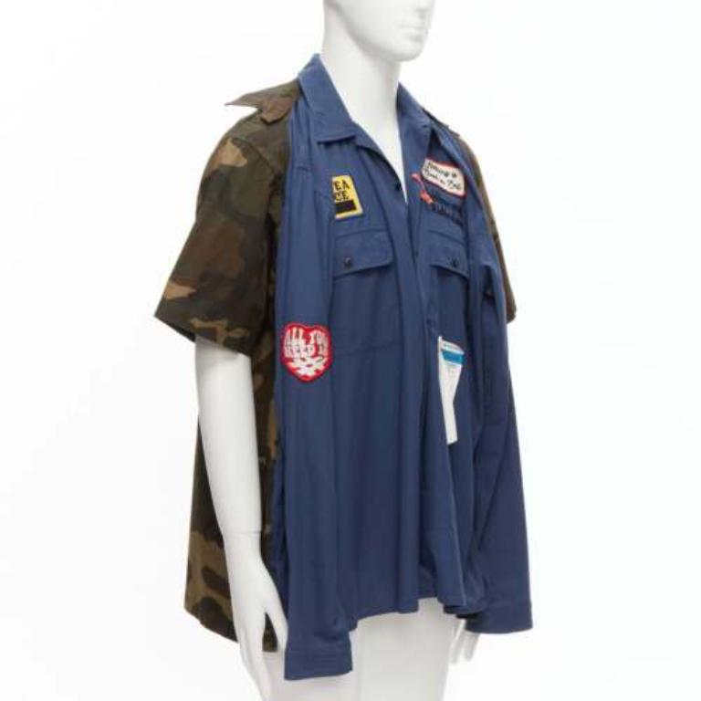 MIHARA YASUHIRO camicia ibrida 2 in 1 blu navy con distintivo vintage IT48 M.
Riferimento: JSLE/A00013
Marchio: Mihara Yasuhiro
Materiale: Cotone
Colore: Blu, Verde
Modello: Camouflage
Chiusura: bottone
Dettagli extra: Camicia a due vie. Stampa camo