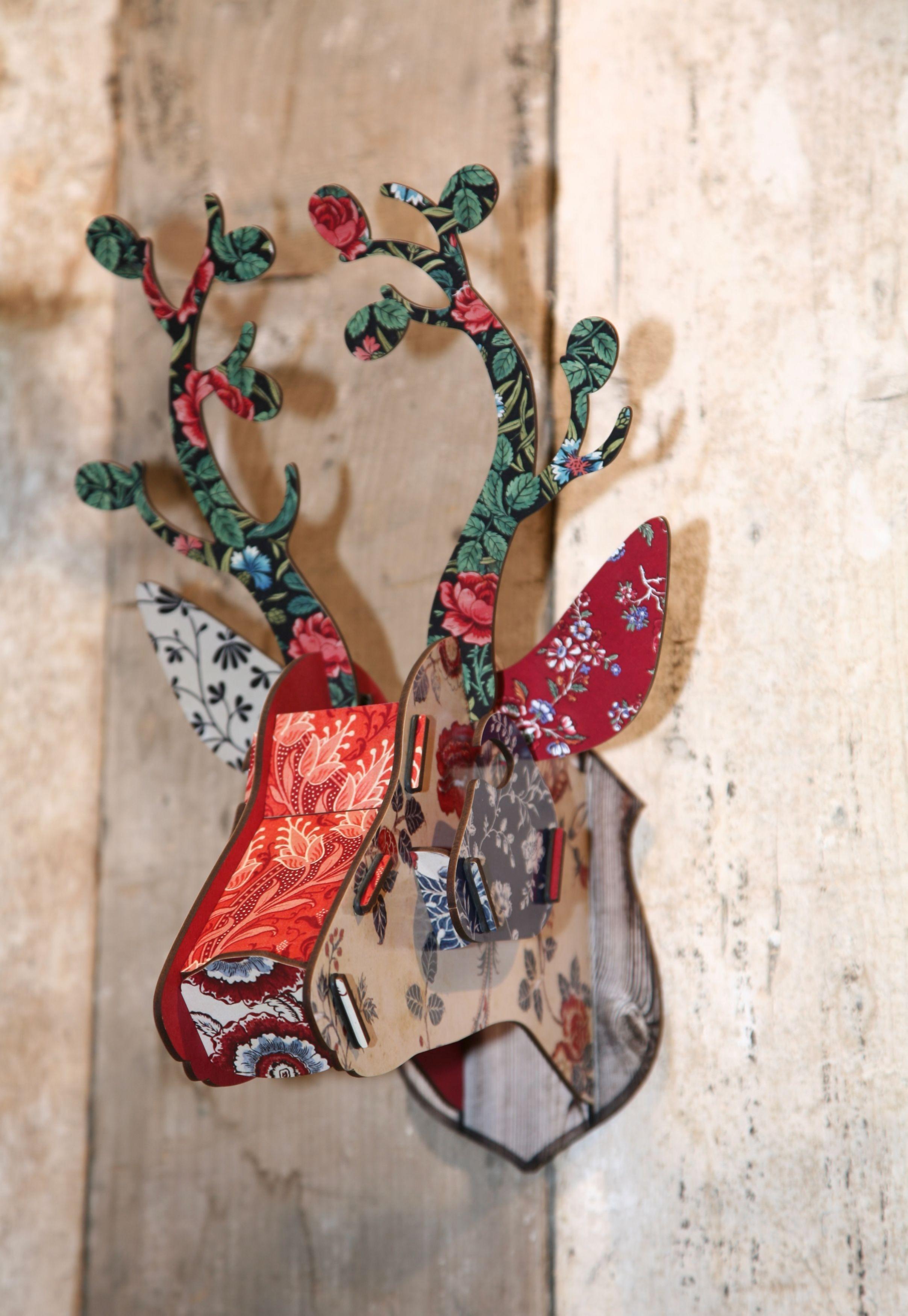 Unusual wall decoration for any room, with a great variety of flowers in red, blue and cream shades. 
Crafted from MDF in Germany, each deer head arrives flat packed with simple instructions: fun and easy to assemble. Sections click together and are