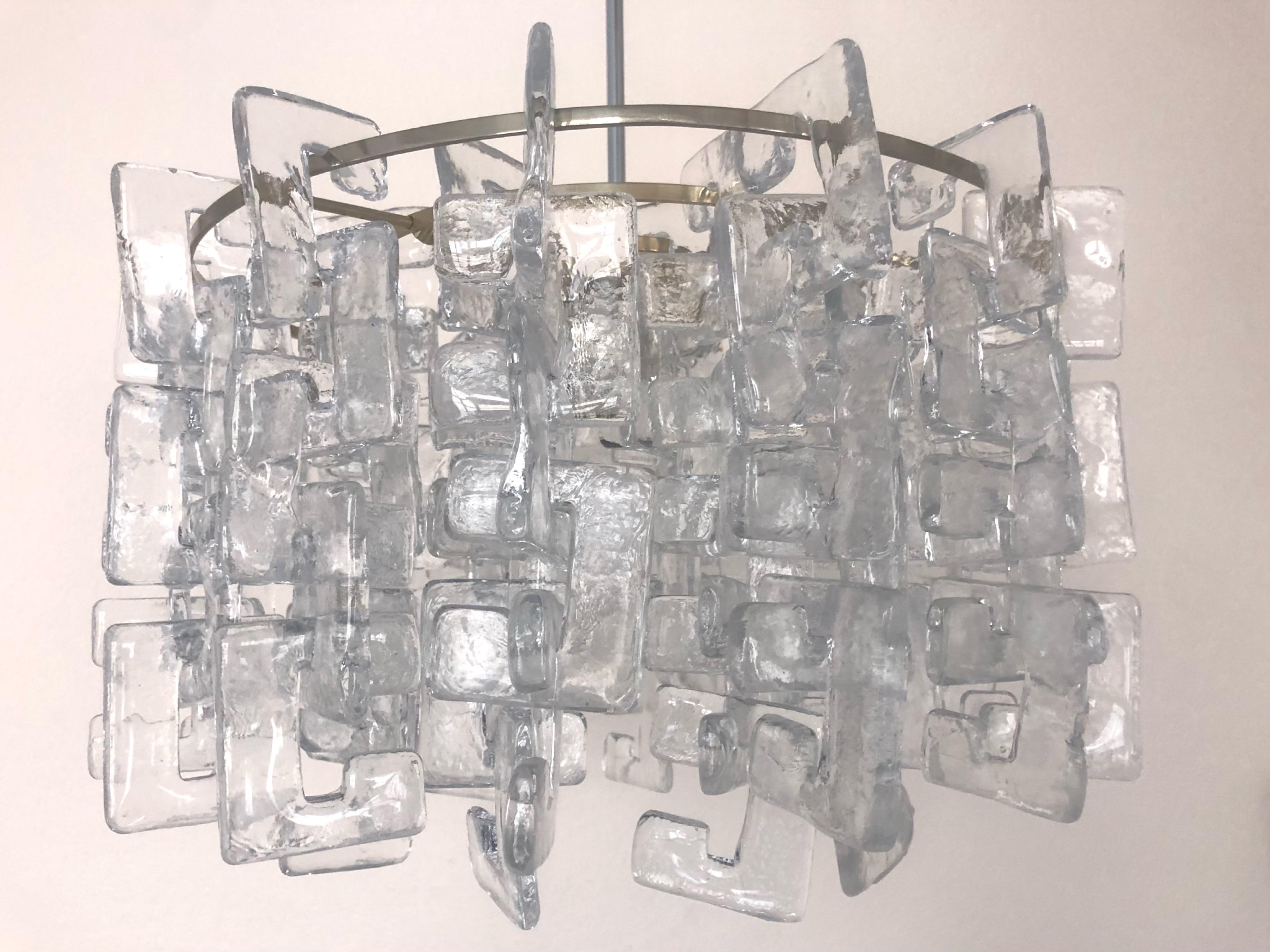 Beauty and stunning Interlocking Murano glass Chandelier by Carlo Nason for Mazzega. This Chandelier was designed and manufactured during the 1970s in Italy. 
Mazzega lie in the noble Venetian glassworking tradition; the firm was founded Angelo