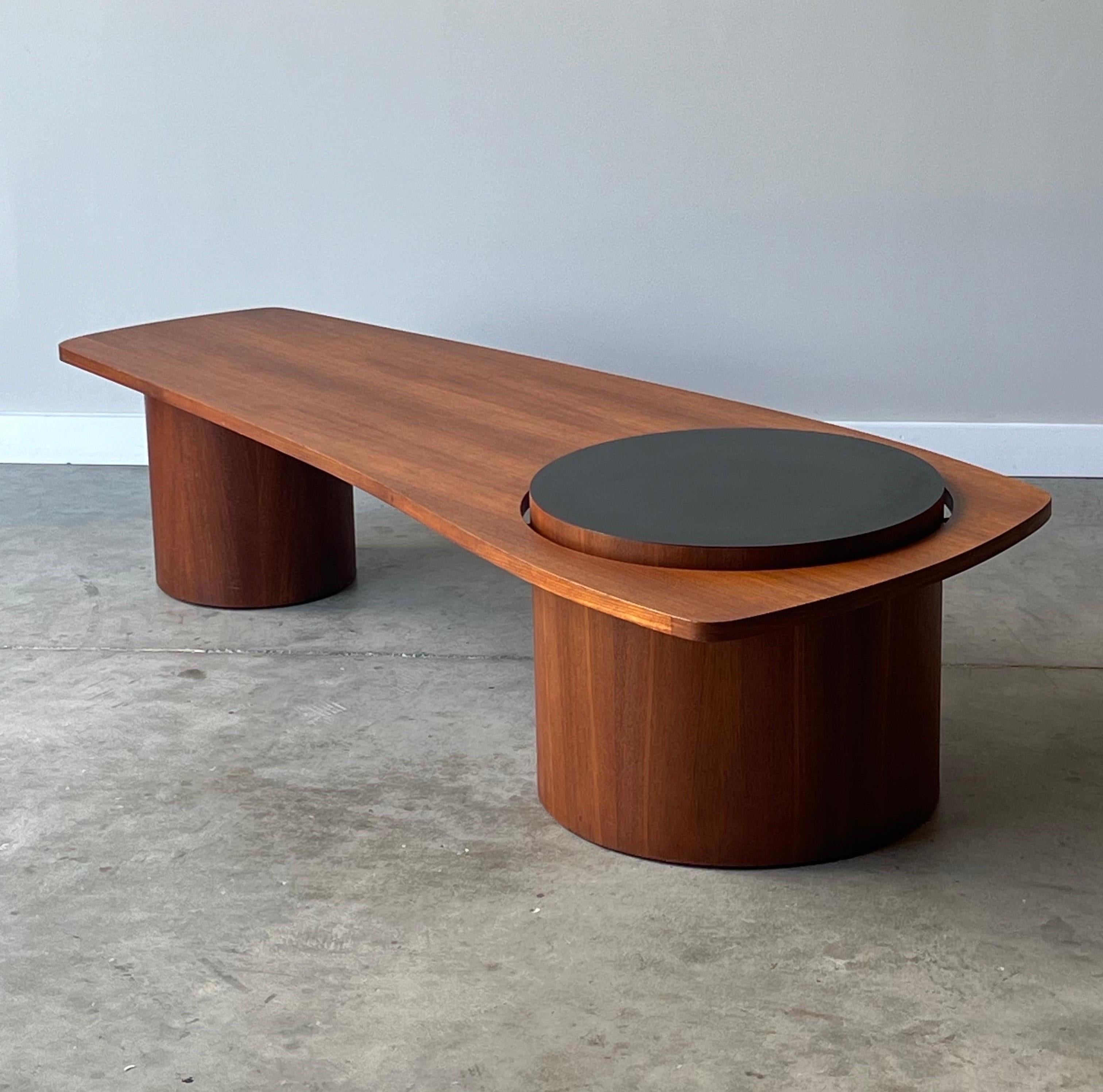 Mid-century ‘Martini’ coffee table manufactured in 1968 by RS Associates, Canada. Originally designed for EXPO 1967 in Montreal. This coffee table consists of two barrels that support the table top. The larger of the two barrels seamlessly