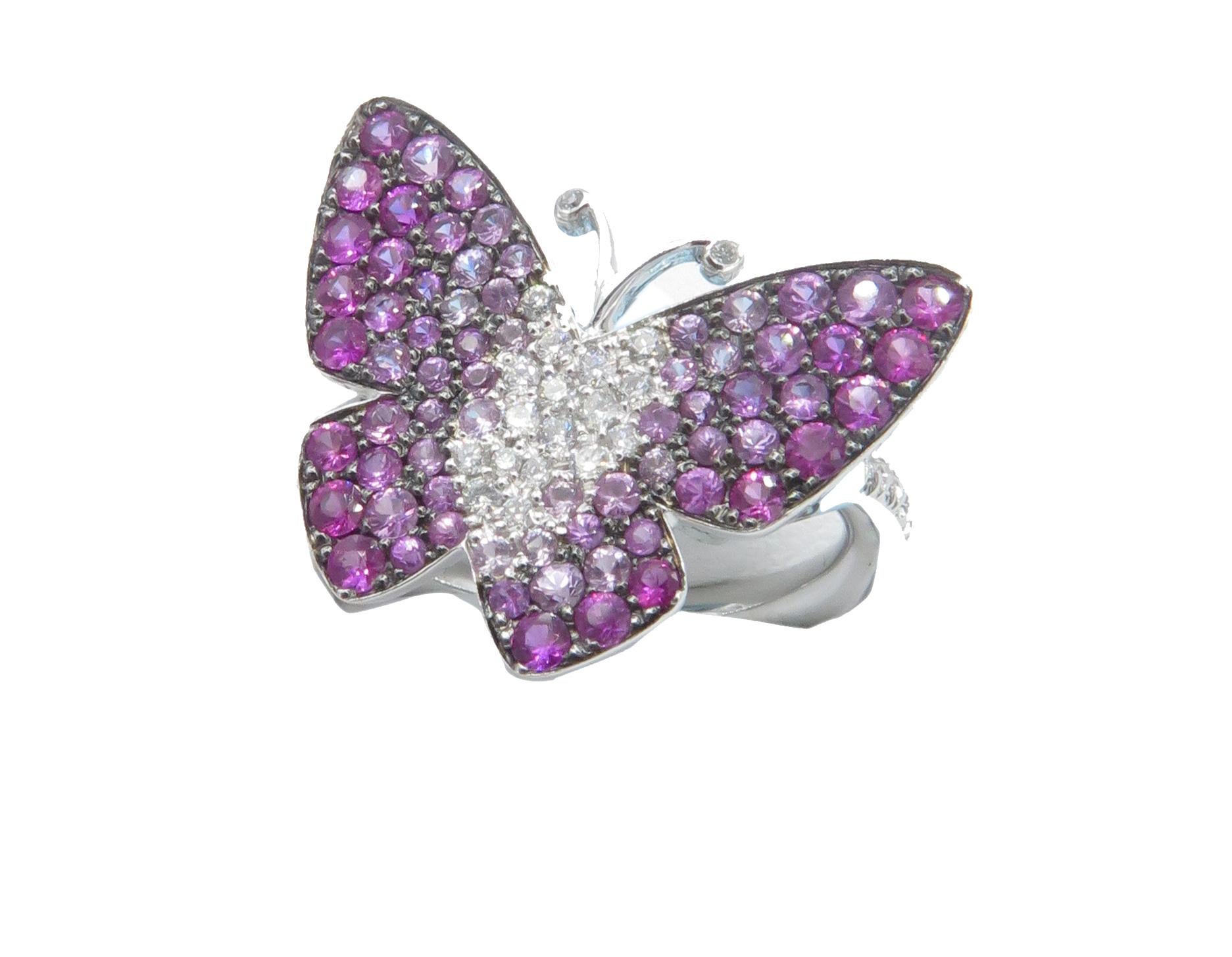 This is a beautiful 18K white gold butterfly ring. The beautiful white gold butterfly is covered in an array of Sapphires and Diamonds. This, is the signature design of jeweler MIIORI. This, beautiful ring is a US size 6.5. With 1/3 ct in sapphires