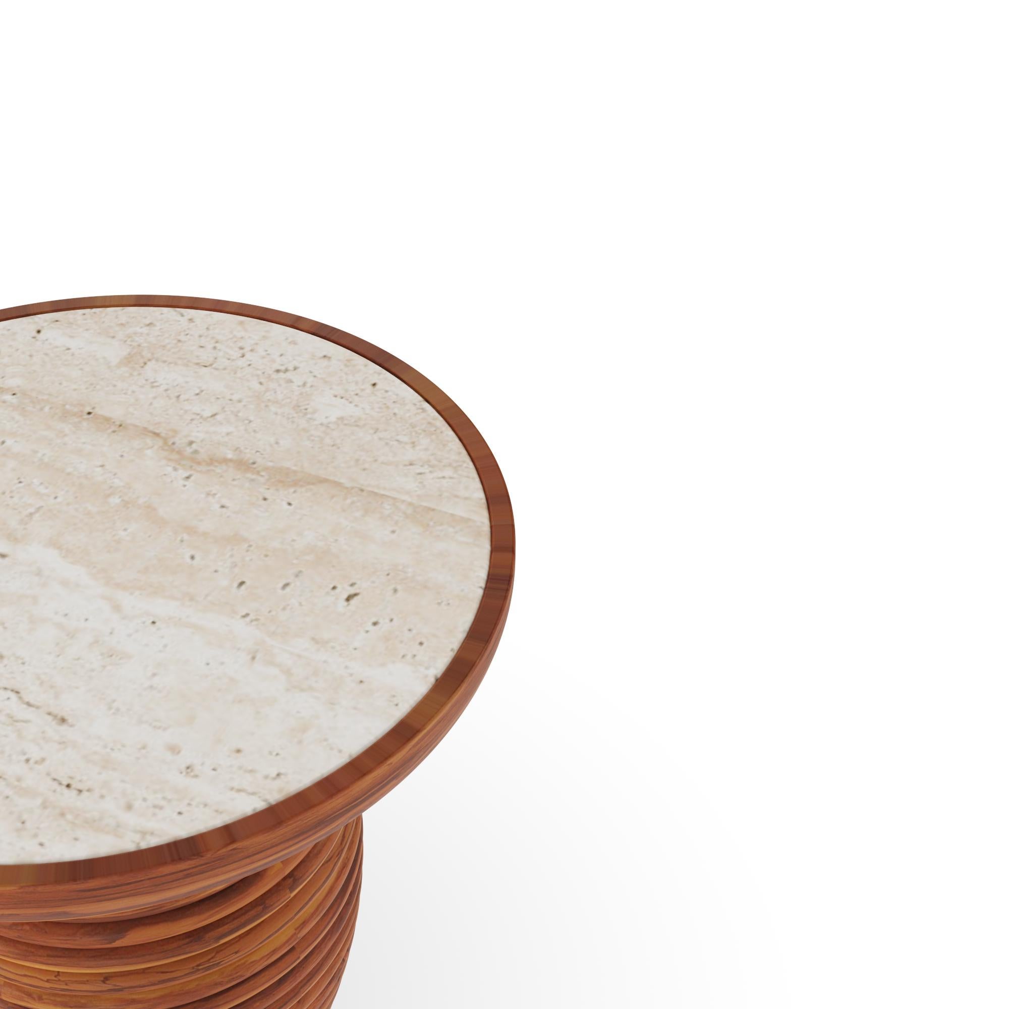 The Mijas Side Table, created in partnership with Mediterrazza, is a refined piece of outdoor luxury furniture, hand crafted to highlight Mediterranean elegance. Its top is meticulously inlaid with natural travertine, bringing timeless stone