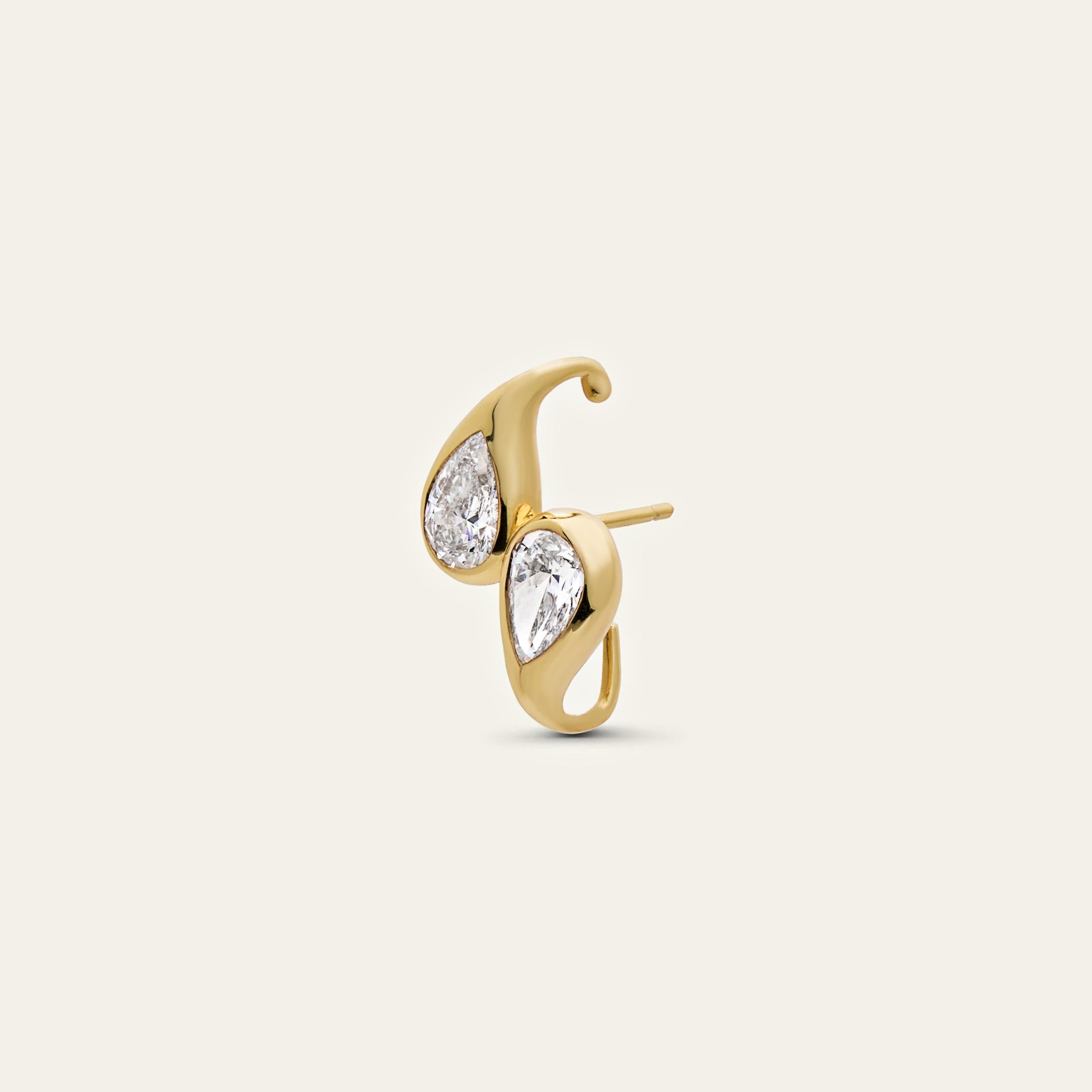 This sculptural yellow gold ear cuff introduces a fresh and refined way to stack earrings. Creating the illusion of an exquisitely wrapped ear cuff, the Mika Earring is pierced through for a comfortable, secure fit. Inspired by elements of the