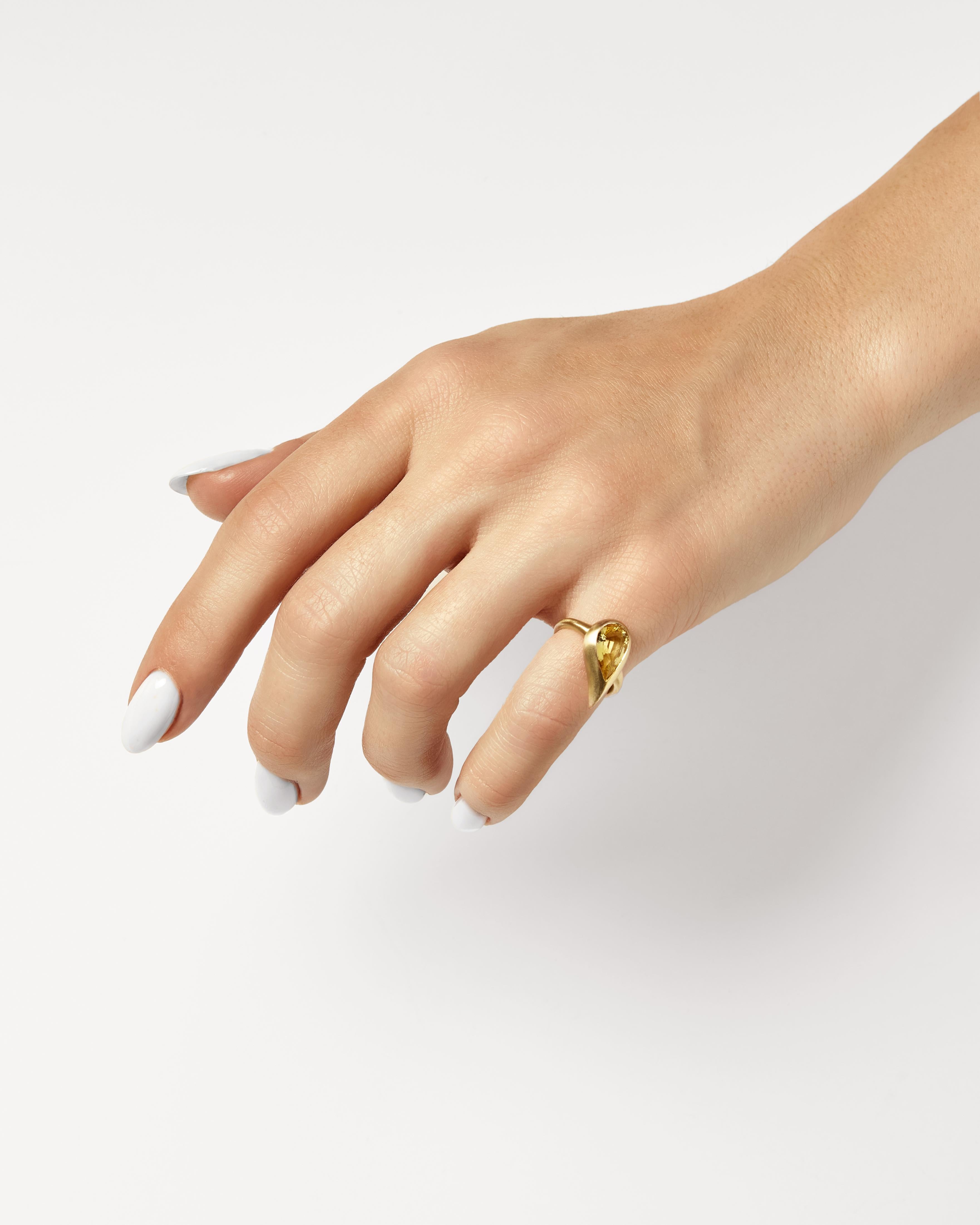 In the world of fine jewelry, the pinky ring reigns supreme. Everyone needs an excuse to raise their glass, and this exceptional bezel-set yellow sapphire pinky ring delivers. Inspired by elements of the earth, The Mika Pinky Ring features a sleek