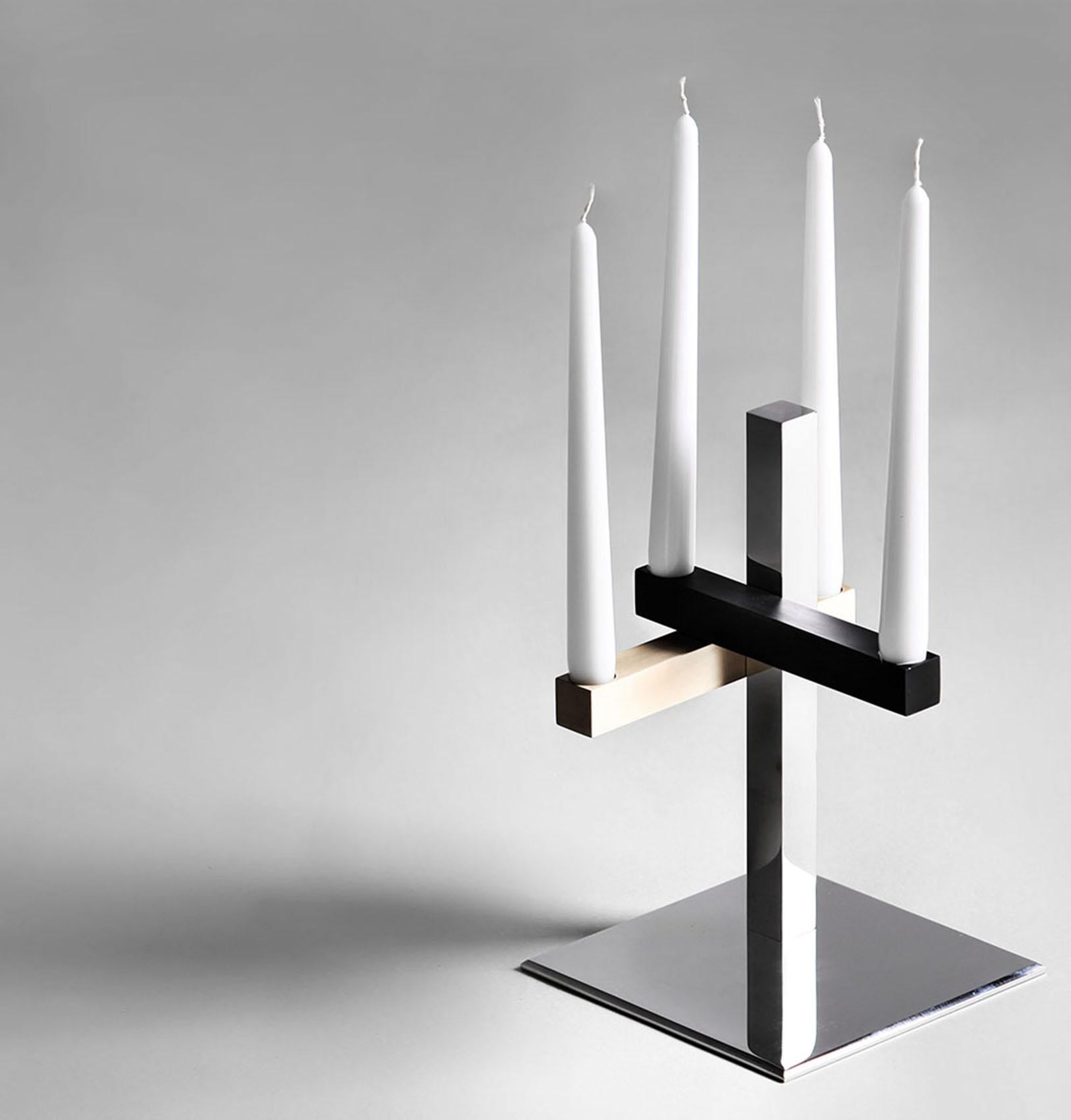 In a simple way, this candle holder is the smallest design of the Mikado line.
It is made of polished stainless steel, gun metal, brushed light oxidized brass base.