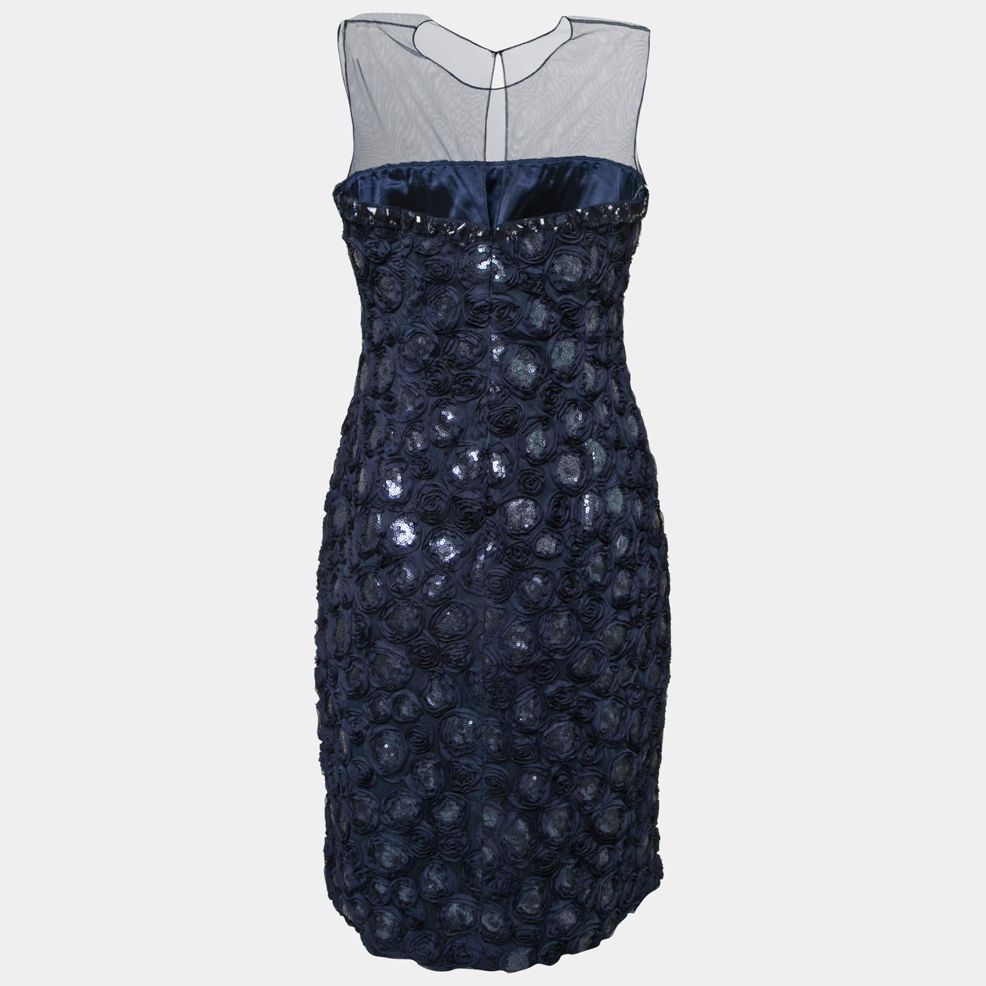 This upscale dress from the house of Mikael Aghal features a brilliant design making it a must-have piece in your closet. Opt for this dreamy navy blue dress when you go out for an evening event carrying a statement clutch. It features rose
