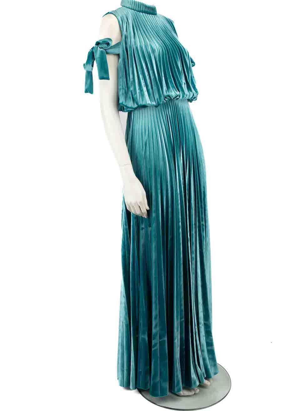 CONDITION is Very good. Minimal wear to dress is evident. Minimal wear to the neckline lining with discoloured marks on this used Mikael Aghal designer resale item.
 
 
 
 Details
 
 
 Teal
 
 Velvet
 
 Gown
 
 Pleated
 
 Mock neck
 
 Open back
 
