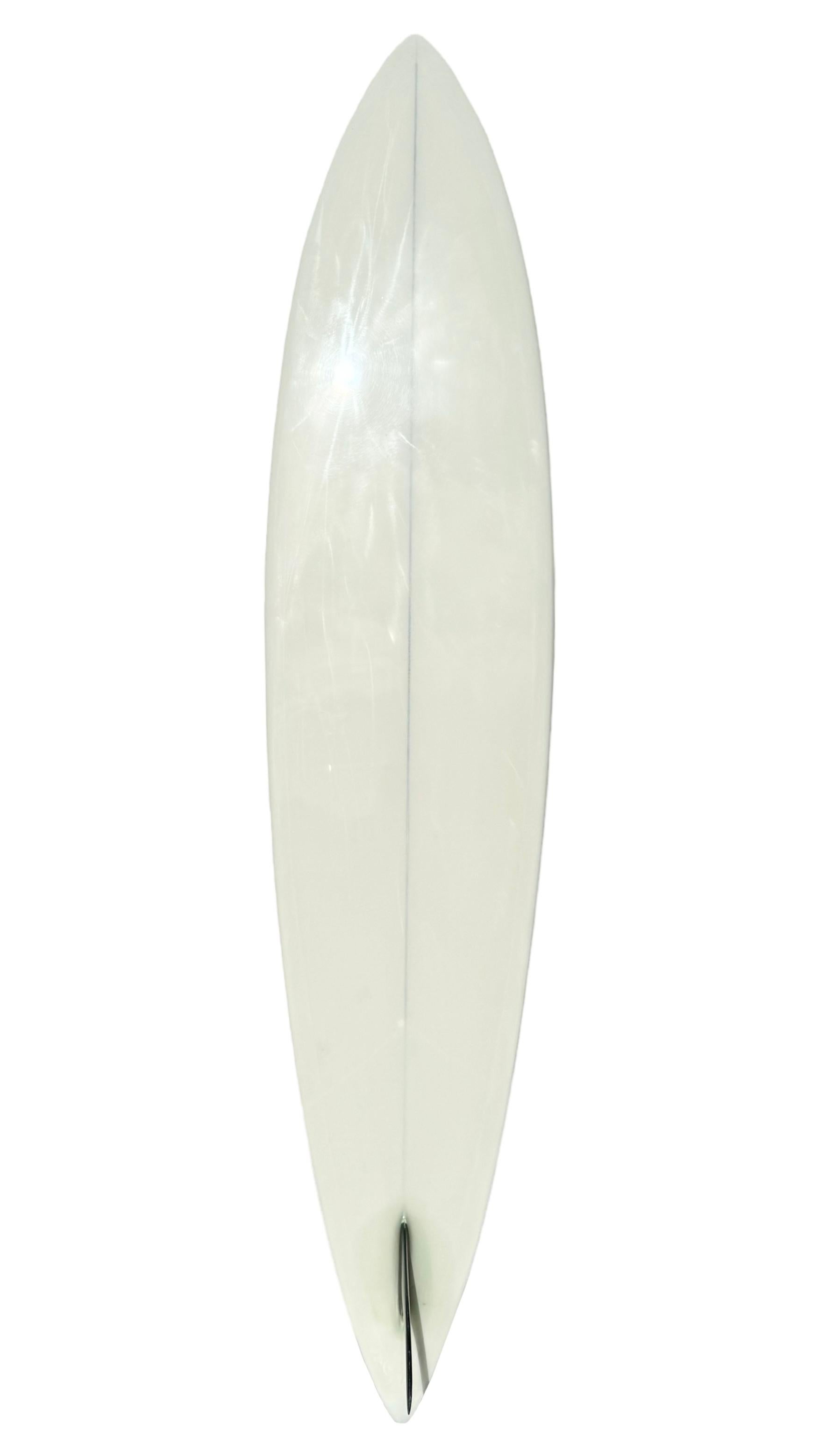 1970s vintage Mike Diffenderfer pintail surfboard. Features a beautiful ivory tint with black pinstriping and matching glassed on fin. A remarkable example of an early 1970s surfboard shaped by the revered surfboard design pioneer, Mike