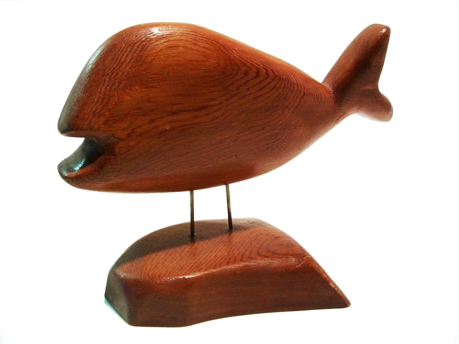 MIKE MATAS - Vintage folk art hand-carved pine model of a whale - mounted by two brass pins to the base - finished with a semi-gloss varnish - signed and dated - possibly from the east coast of Canada - circa 1980. 

Excellent vintage condition - no