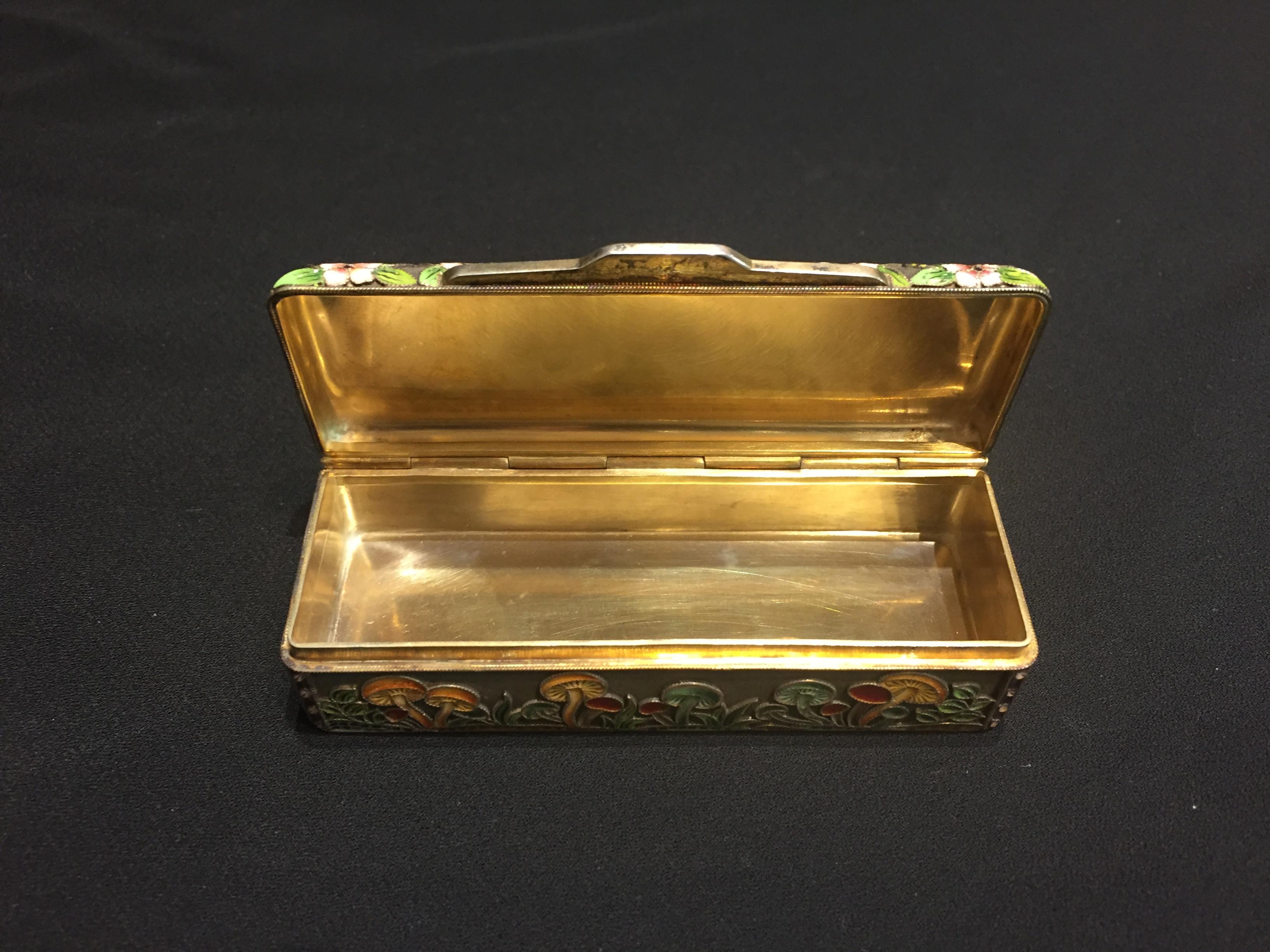 Rare and unique, this sterling silver, enamel and gilt snuffbox, decorated with mushrooms was commissioned in a single copy by the known New York City art collector, antiquarian and gallerist, Mikhail Krikheli.

Hallmarked with “STERLING” and two