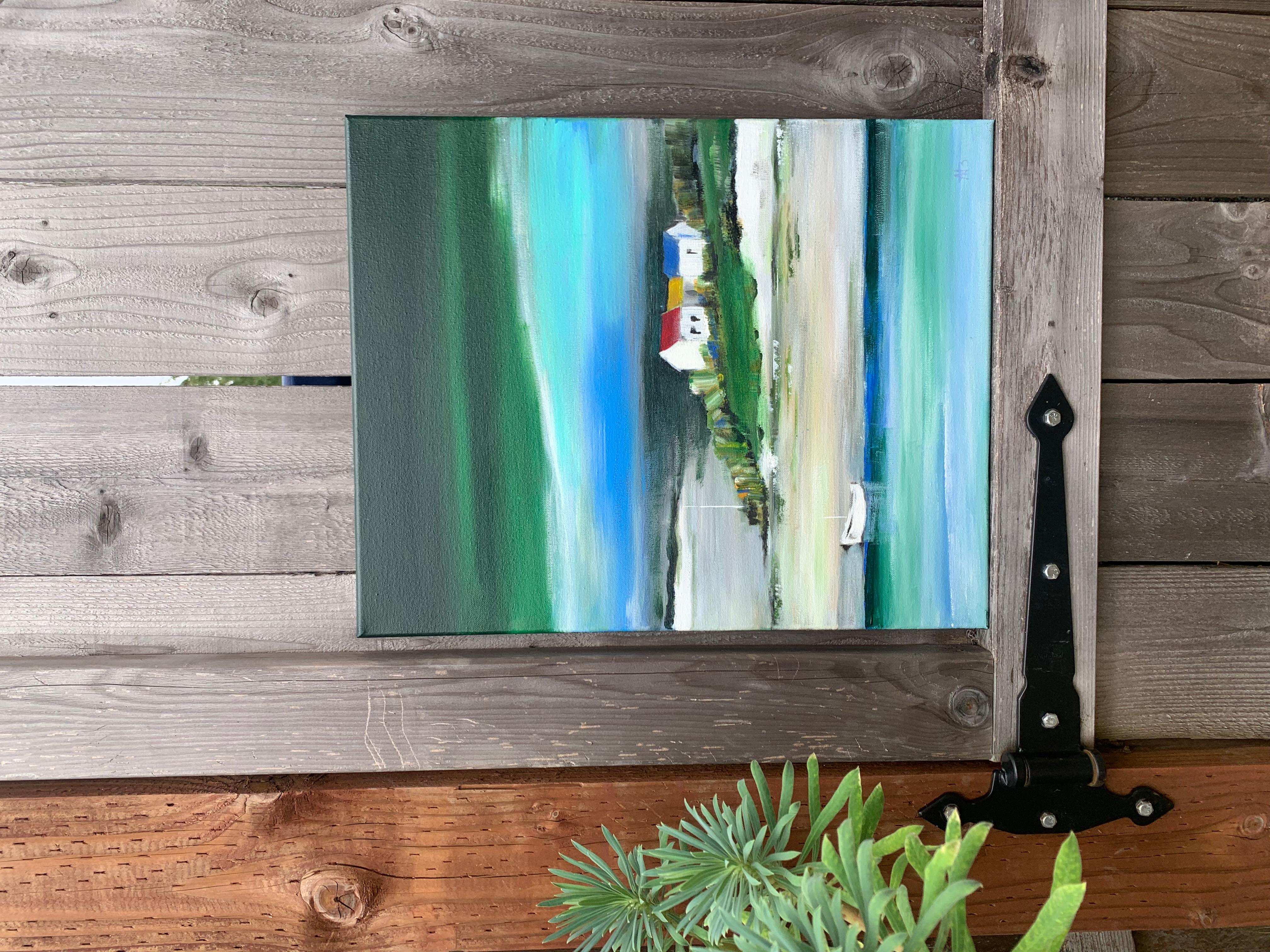 <p>Artist Comments<br>Two small houses with brightly colored roofs sit quietly on a grassy slope overlooking a tranquil bay. A white boat drifts on the still water, its reflection blending with shifting tones of blue and green. Above, heavy clouds
