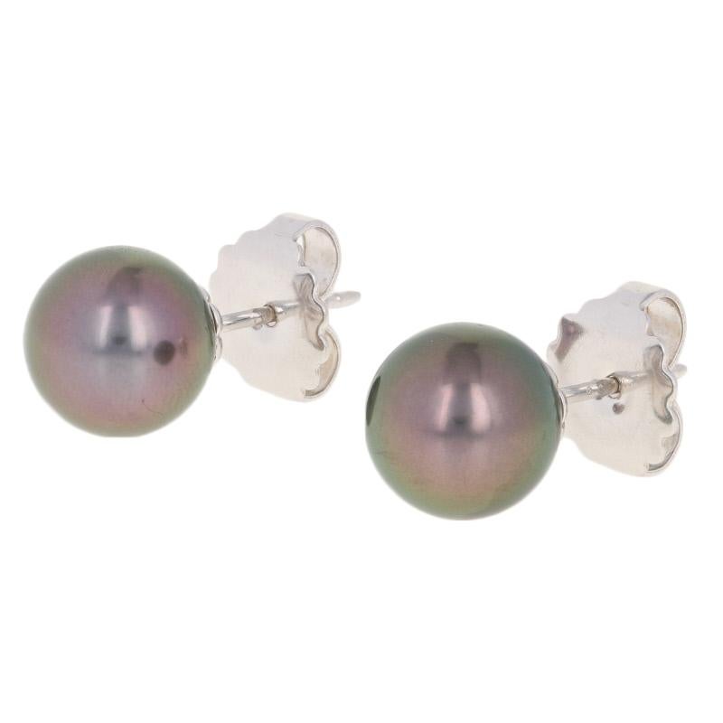 Step out in style with Mikimoto! Fashioned in a timeless stud design, this pair of earrings showcase luxurious Tahitian black South Sea pearls set in glistening 18k white gold. These designer earrings originally retail for $3,270 but they are being