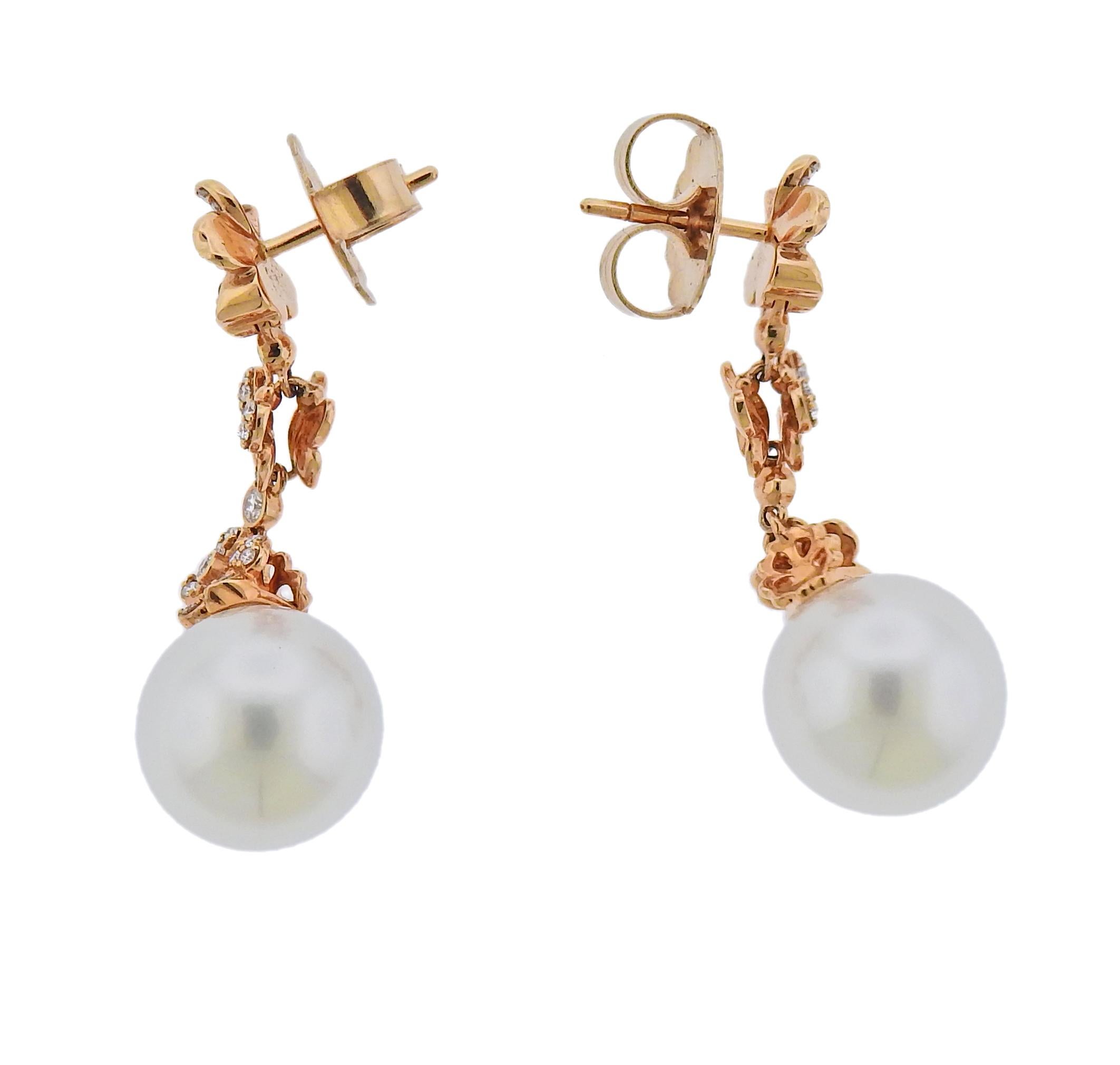 Pair of new 18k rose gold drop earrings by Mikimoto, set with A+ 11.8mm South Sea pearls and approx. 0.50ctw G/VS diamonds. Retail $11000. Come with box and warranty.  Earrings are 35mm long. Weight 10 grams. Marked: M mark 750.