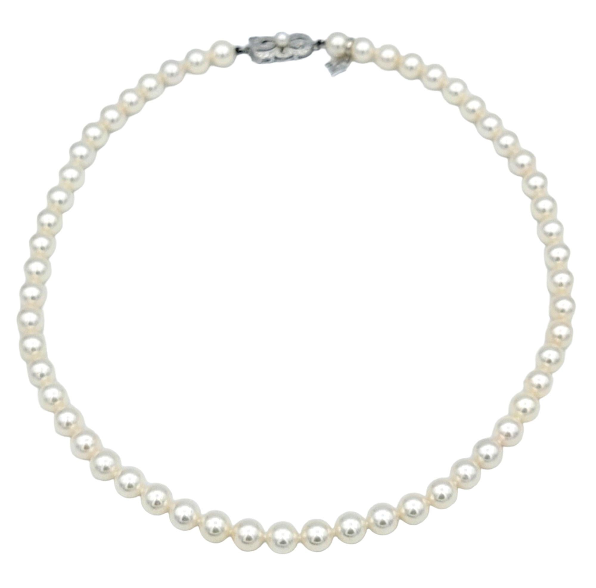This gorgeous Mikimoto Akoya pearl necklace epitomizes elegance and refinement, showcasing the brand's renowned craftsmanship and the natural beauty of pearls. Each lustrous creamy pearl is meticulously selected and expertly matched to create a