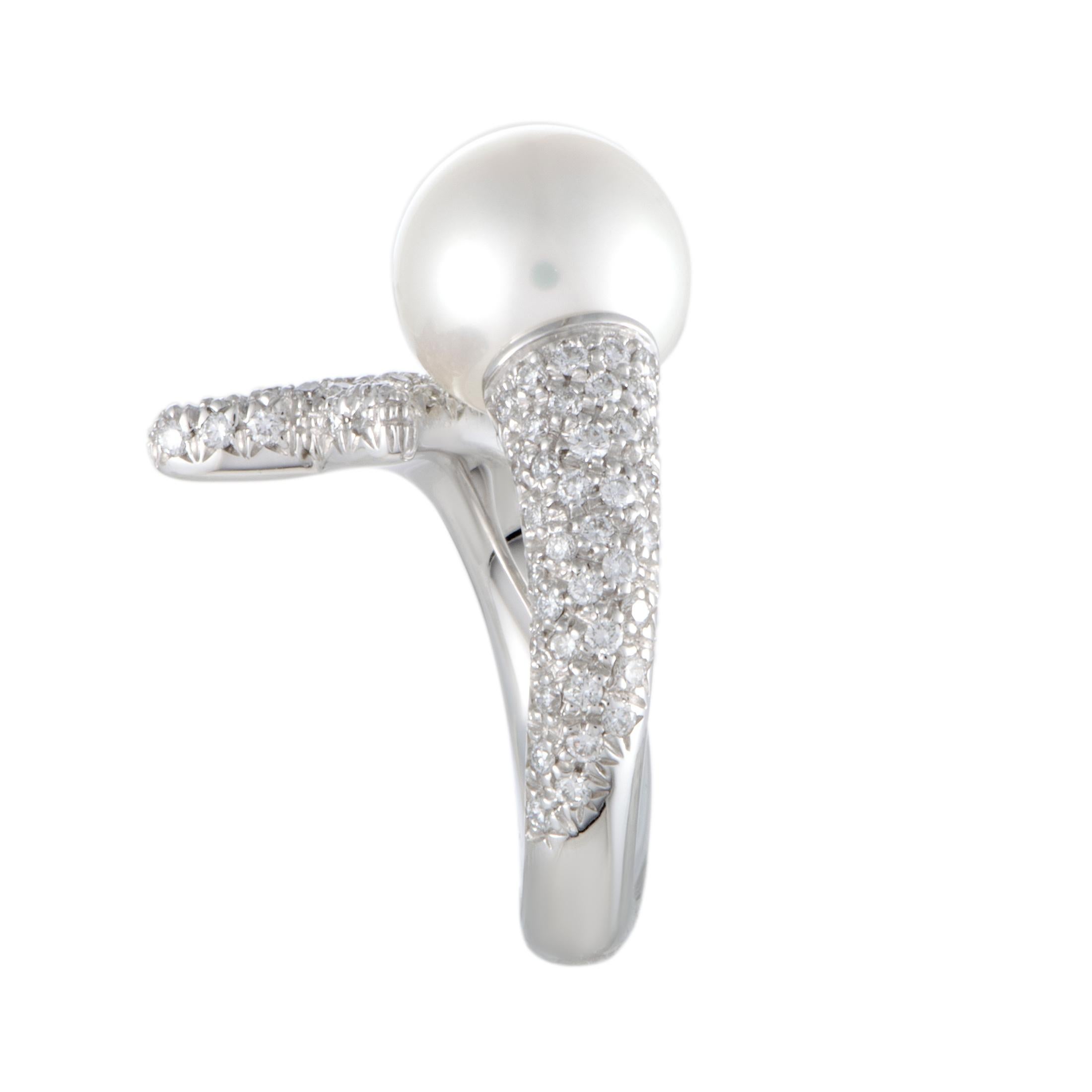 A wonderful sense of sublime femininity is present in this gorgeous ring that compels with its splendidly elegant design and incredibly lustrous décor. The ring is created by Mikimoto and it is exquisitely crafted from prestigiously gleaming 18K