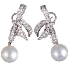 Mikimoto 18 Karat White Gold Diamond and White Pearl Dangle Bow Earrings