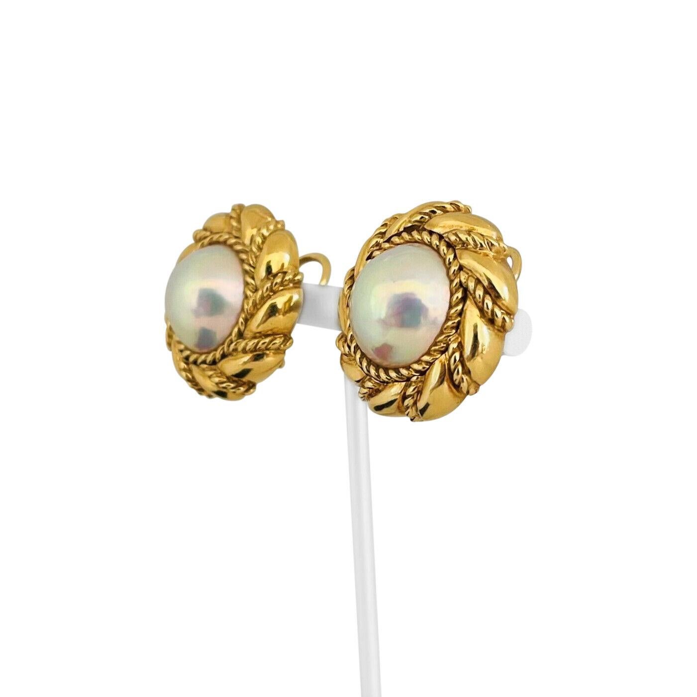 Mikimoto 18k Yellow Gold and 15mm Mabe Pearls Earclips

Condition:  Excellent Condition
Metal:  18k Gold (Marked, and Professionally Tested)
Weight:  28.3g Total Both Earrings
Pearls:  15mm Mabe Pearls
Pearls Description:  Whitish with strong rose