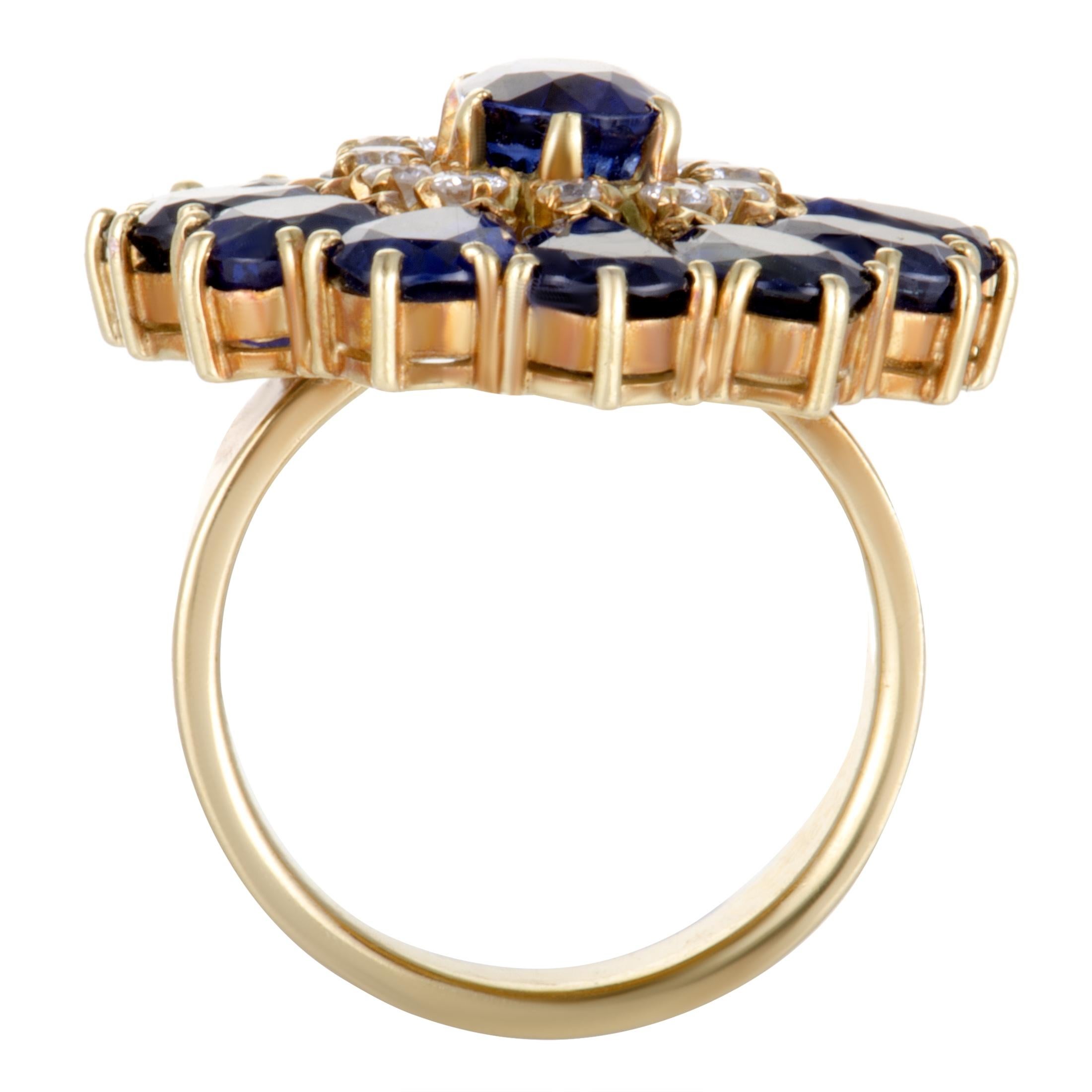 This utterly stunning ring by Mikimoto is uniquely crafted in the beautiful glisten of 18K yellow gold. The spectacular floral design is adorned in 0.36ct of dazzling diamonds and 8.19ct of sensational blue sapphires that give the ring an
