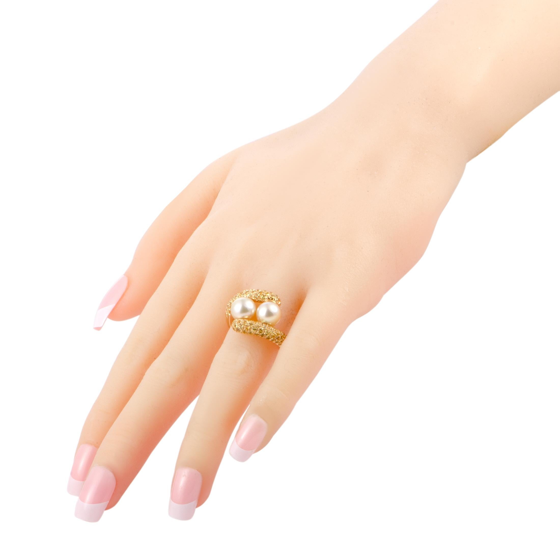 The resplendent combination of yellow gold and yellow sapphires presents a stunning backdrop for the sublime Akoya pearls in this delightful ring that boasts a splendidly luxurious appeal. Created by Mikimoto, this ring is masterfully crafted from