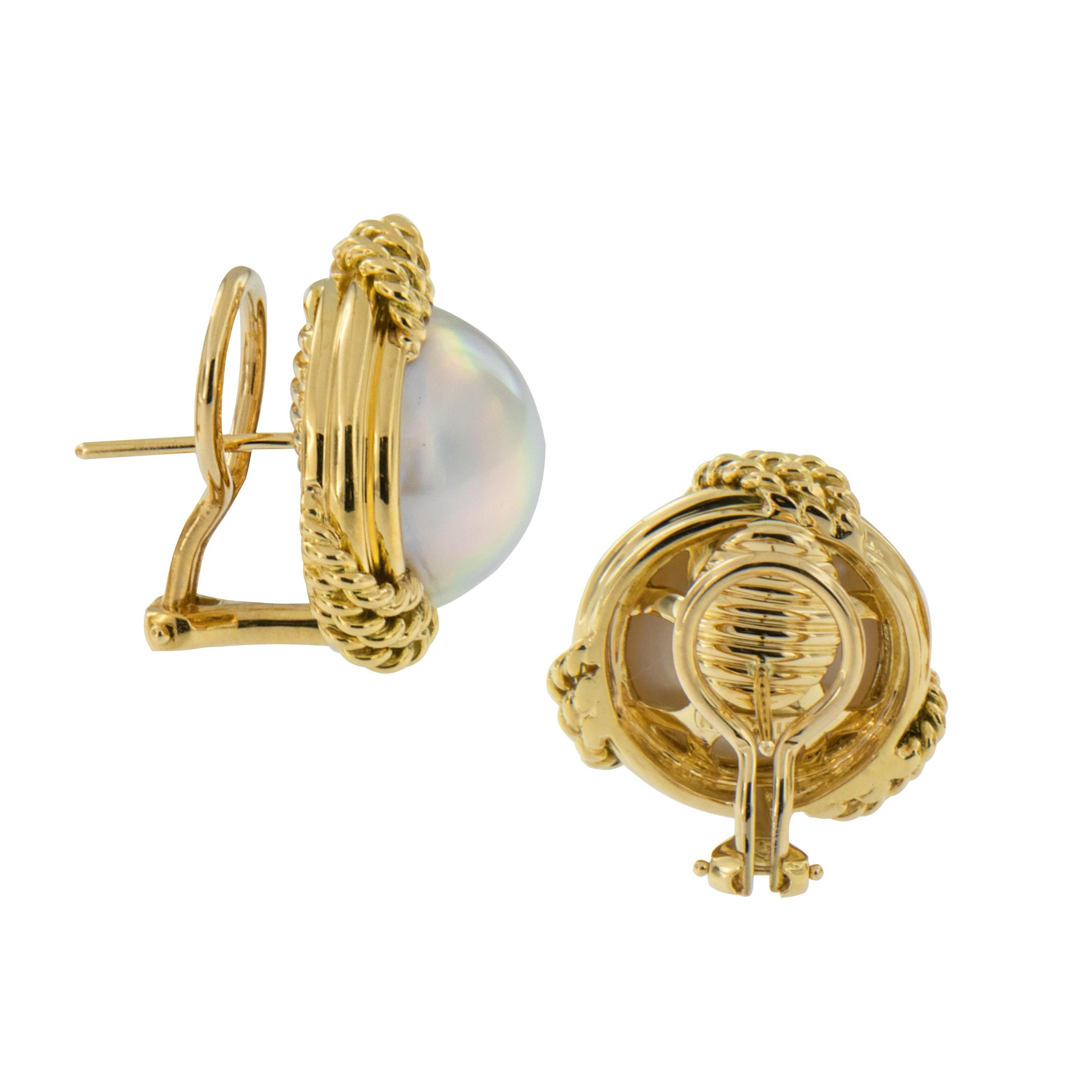 Pearls on the half shell by renowned designer & cultured pearl father Mikimoto! A magnificent pair of signed Mikimoto earrings featuring 14mm mabe' pearls in 18K yellow gold twisted wire framework. These classic earrings look great with formal,