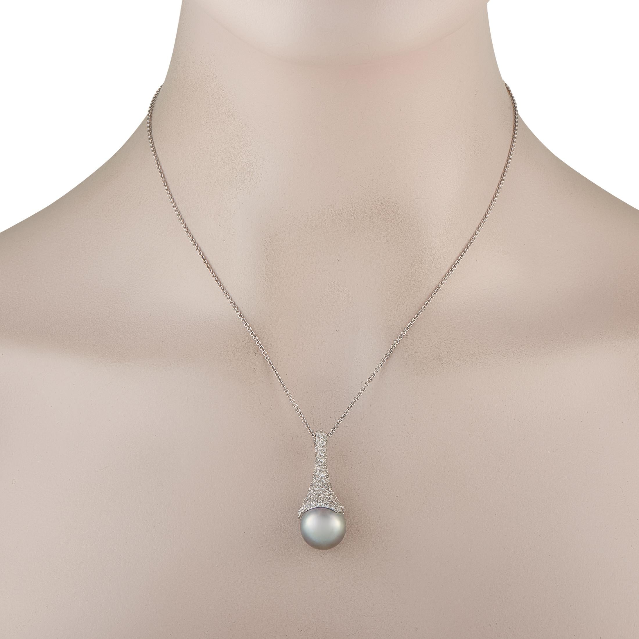 This Mikimoto necklace will effortlessly add a touch of luxury to any occasion. A sleek 18K White Gold pendant beautifully showcases this pieces 13.5mm South Sea Pearl. Inset Diamonds totaling 3.16 carats allow it to continually catch the light and