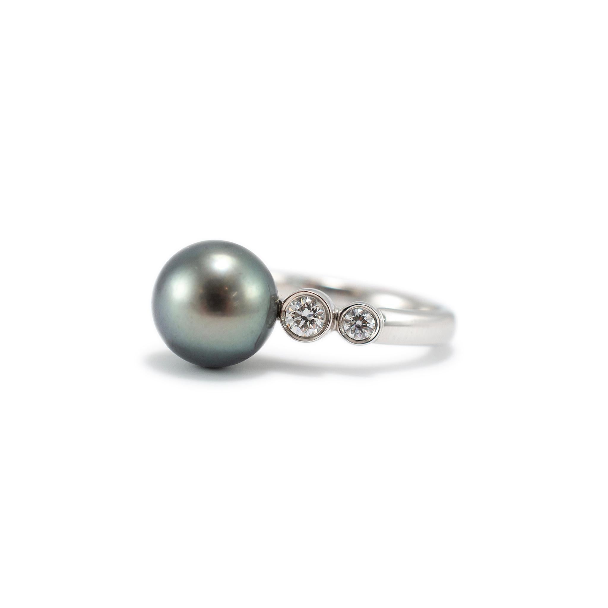 Brand: Mikimoto 

Gender: Ladies 

Metal Type: 18K White Gold

Ring Size: 6.5 

Weight: 5.00 grams

One ladies 18K white gold diamond and pearl accented cocktail ring with a half-round shank. The metal was tested and determined to be 18K white gold.