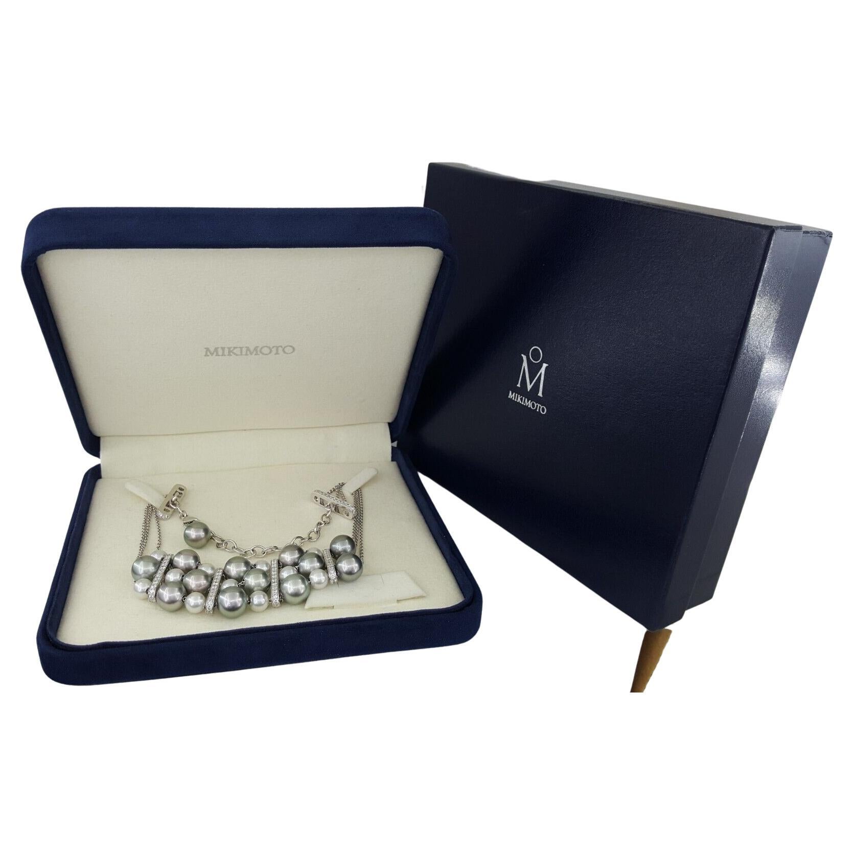 Mikimoto 18K White Gold 7.3-11.1 mm Grayish Silver & Cream Pearl 3-Strand Diamond Choker Necklace.

The Necklace weighs 64.2 grams, the diamond bars are 25mm x 6mm, Adjustable 12-15