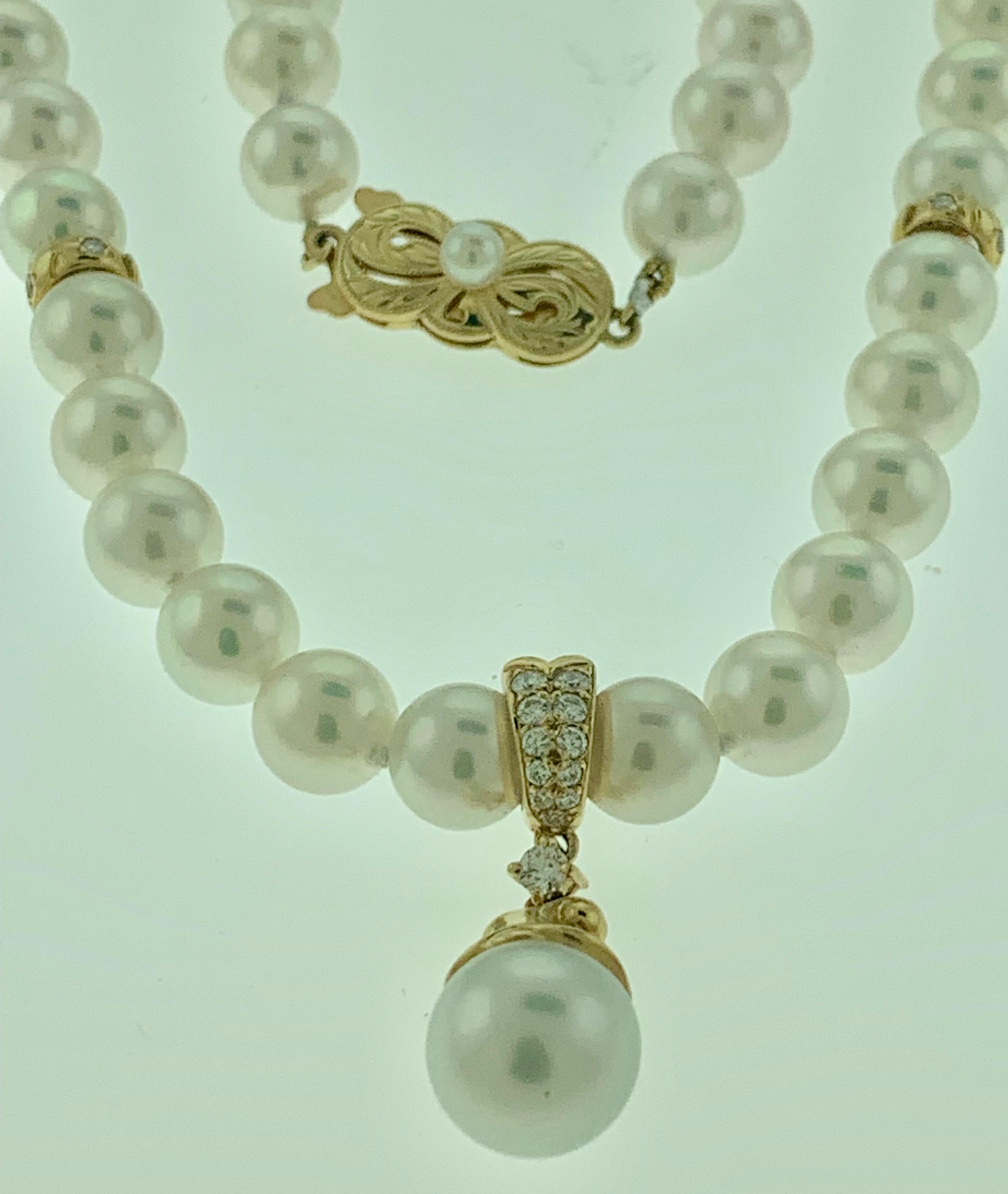 A vintage Mikimoto Akoya cultured pearl single-strand necklace with a diamond   pendant and gold and pearl clasp in 18-karat Yellow gold. The necklace is composed of 57 Akoya cultured pearls of an incredibly high luster  and significant size